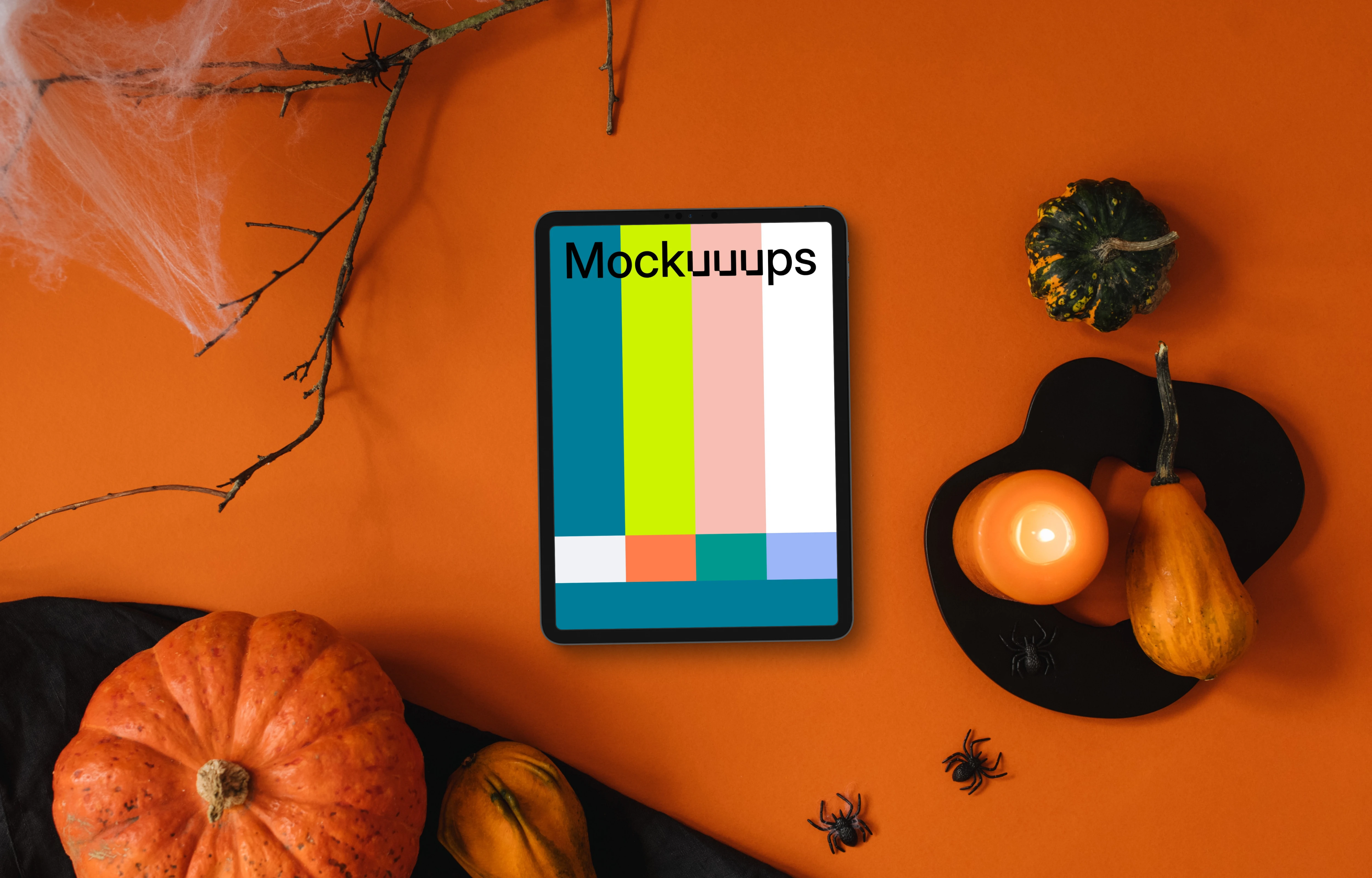 Halloween background mockup with a tablet and spiders