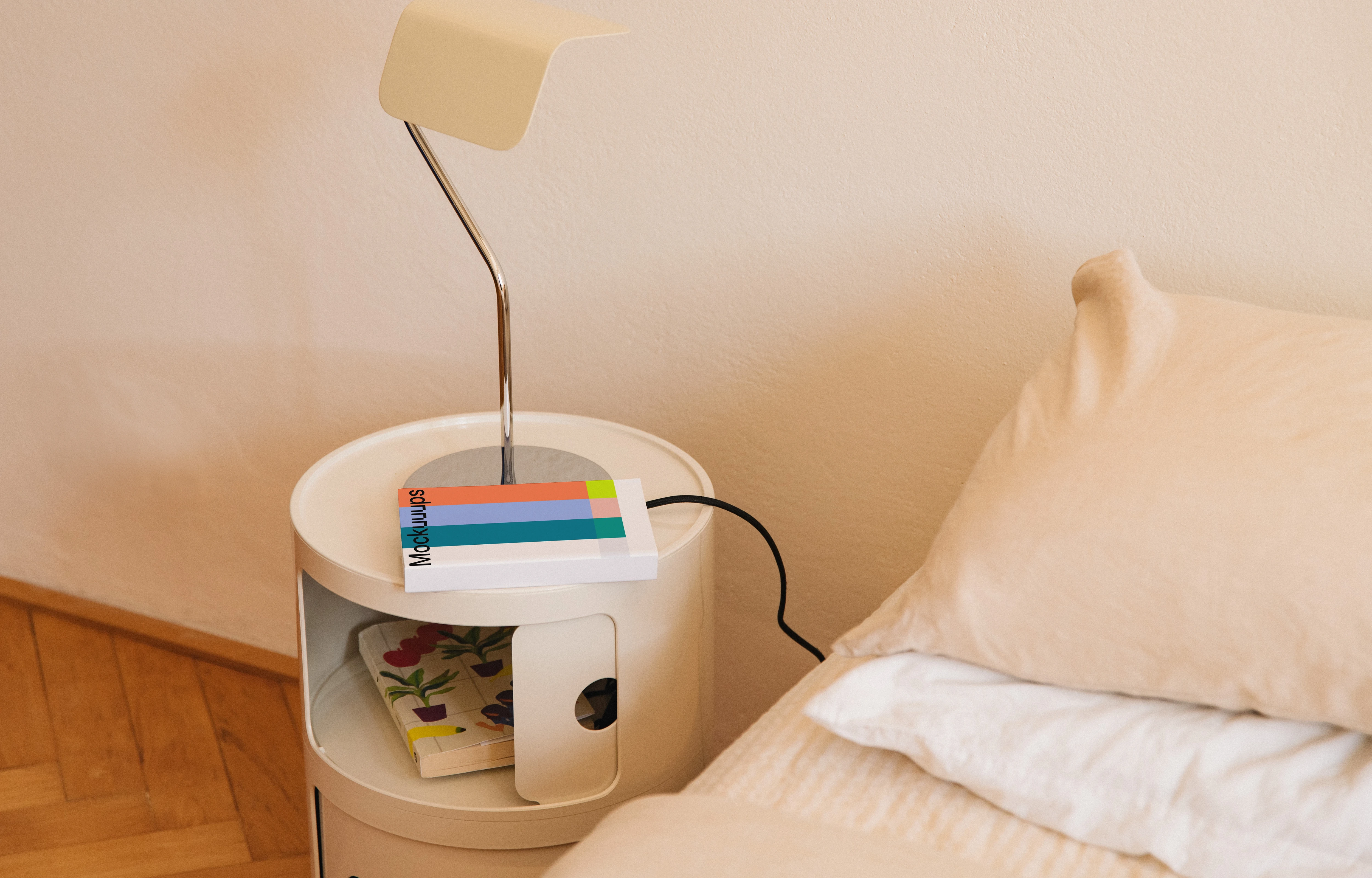 Paperback book mockup on a bedside table