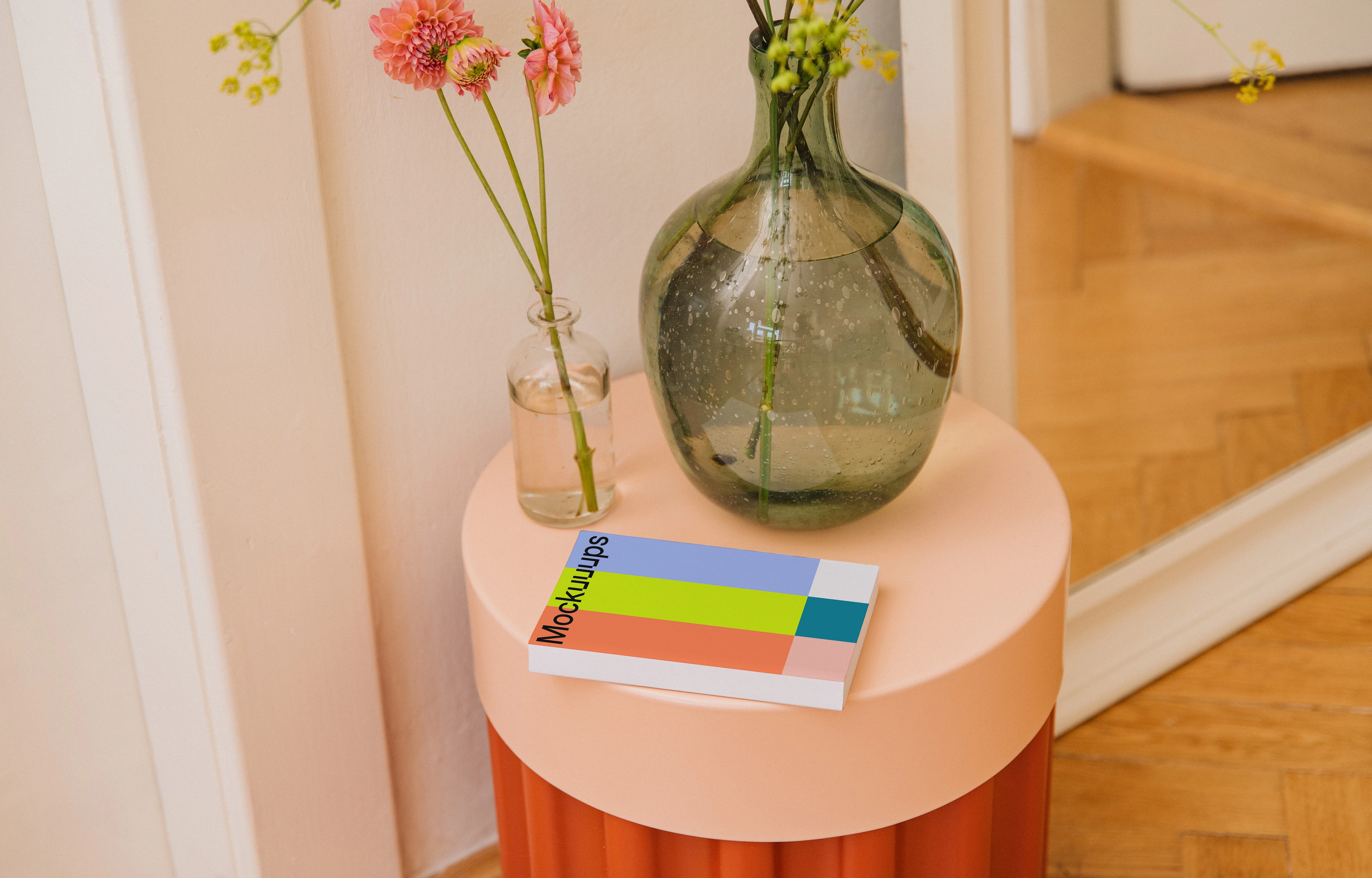 Paperback book mockup on a colorful side table