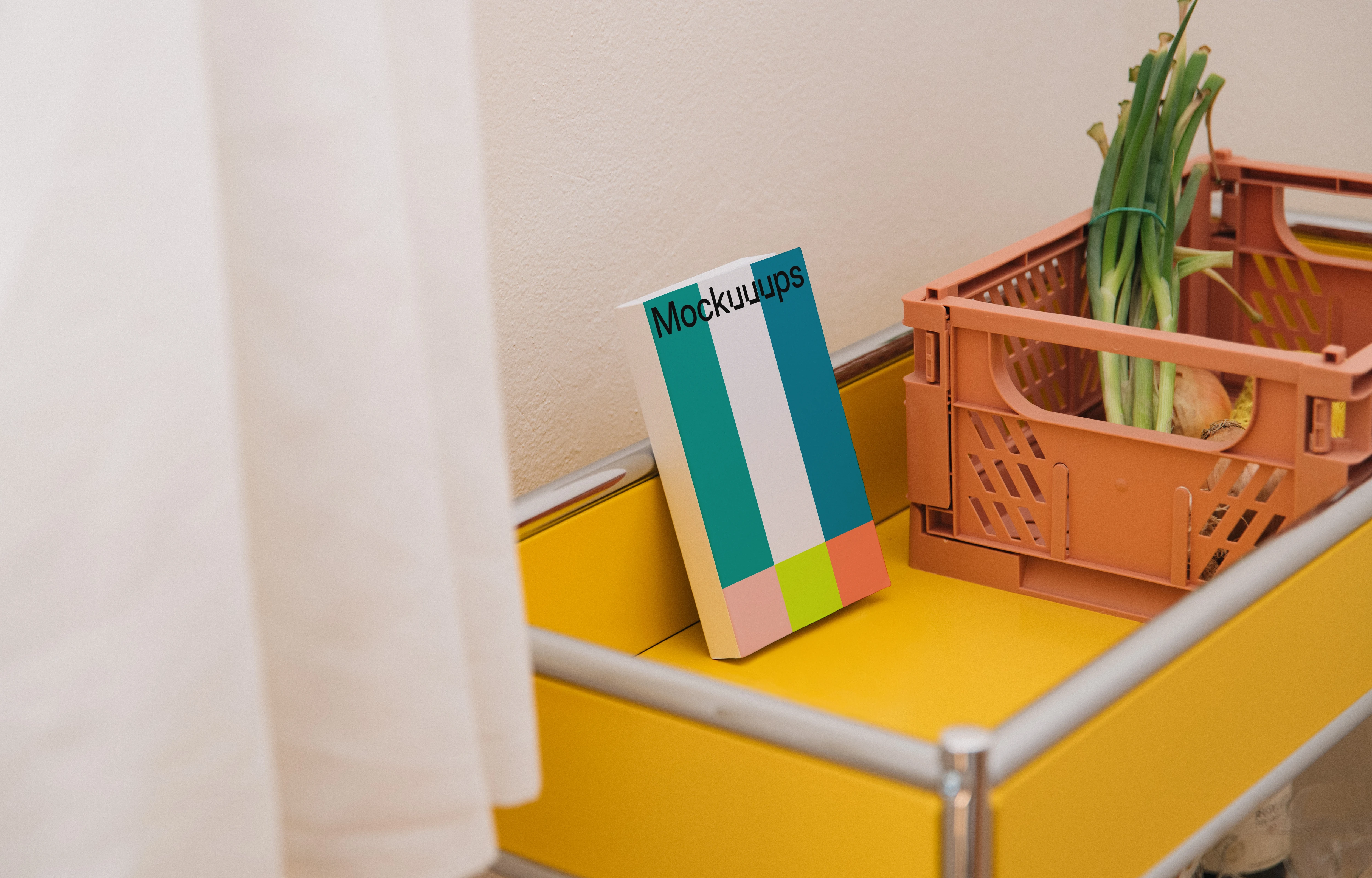 Paperback book mockup on a yellow cart with a crate
