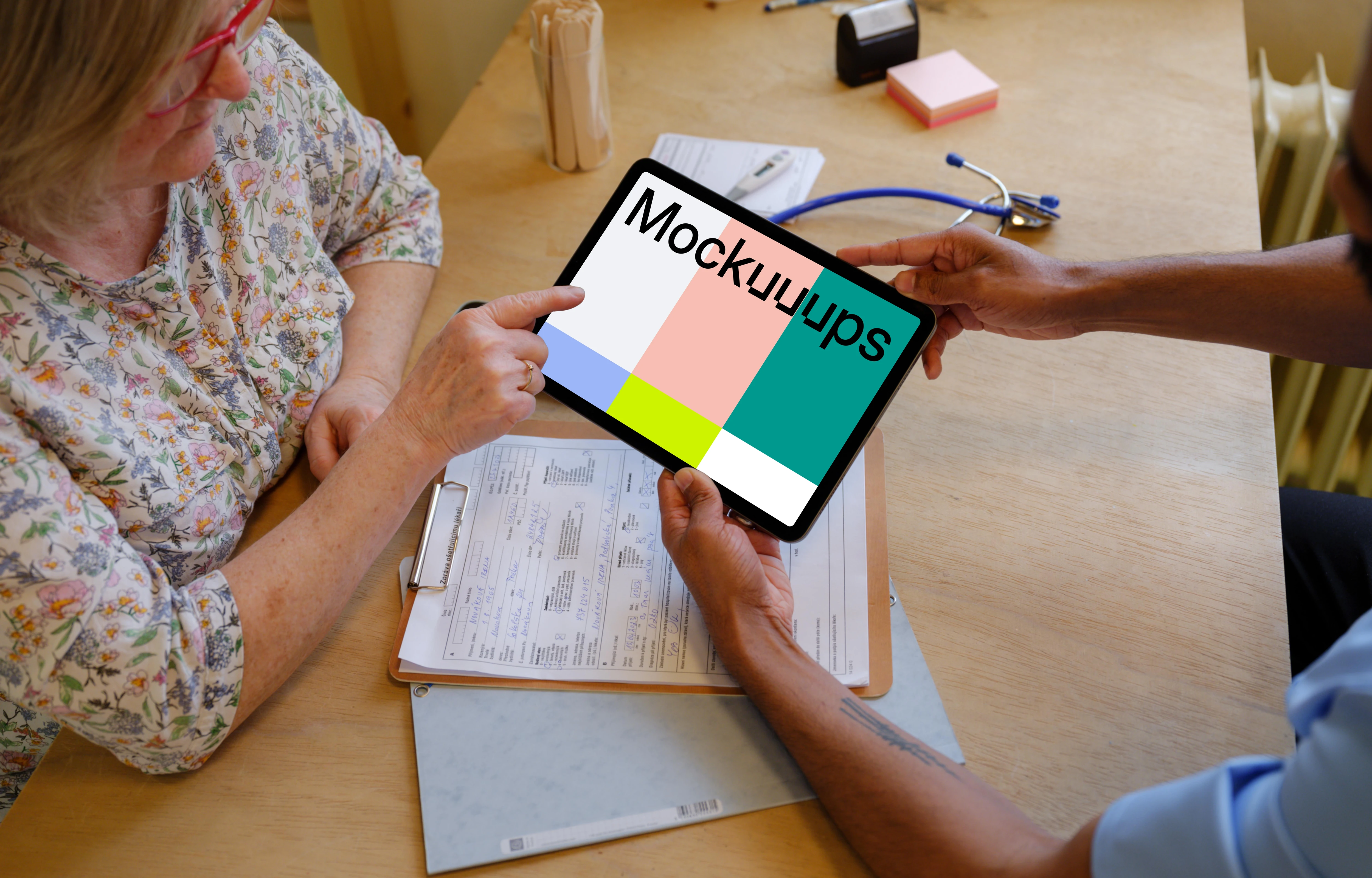 Patient and the doctor with a tablet mockup