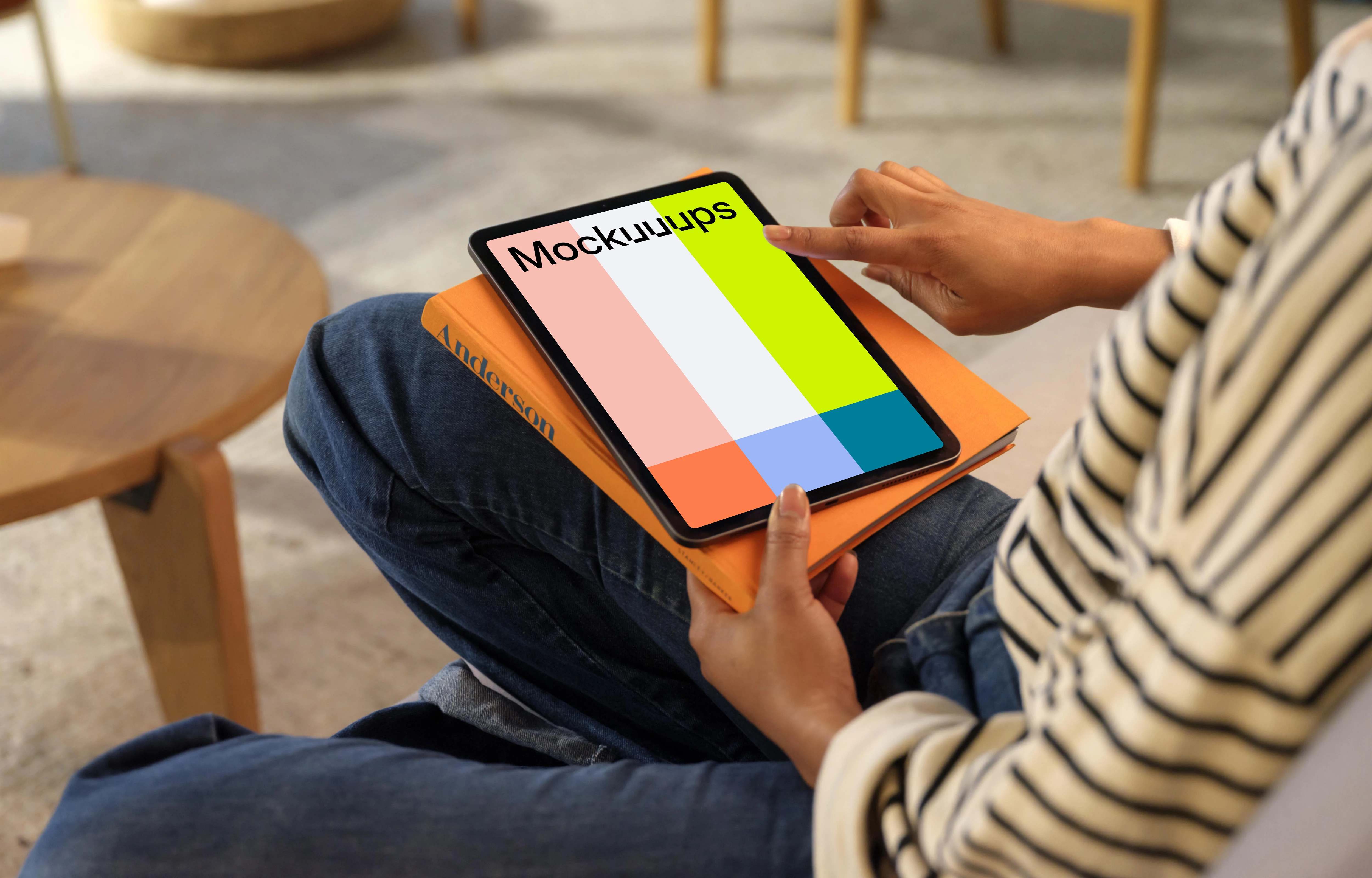 Person scrollin on an iPad Air mockup