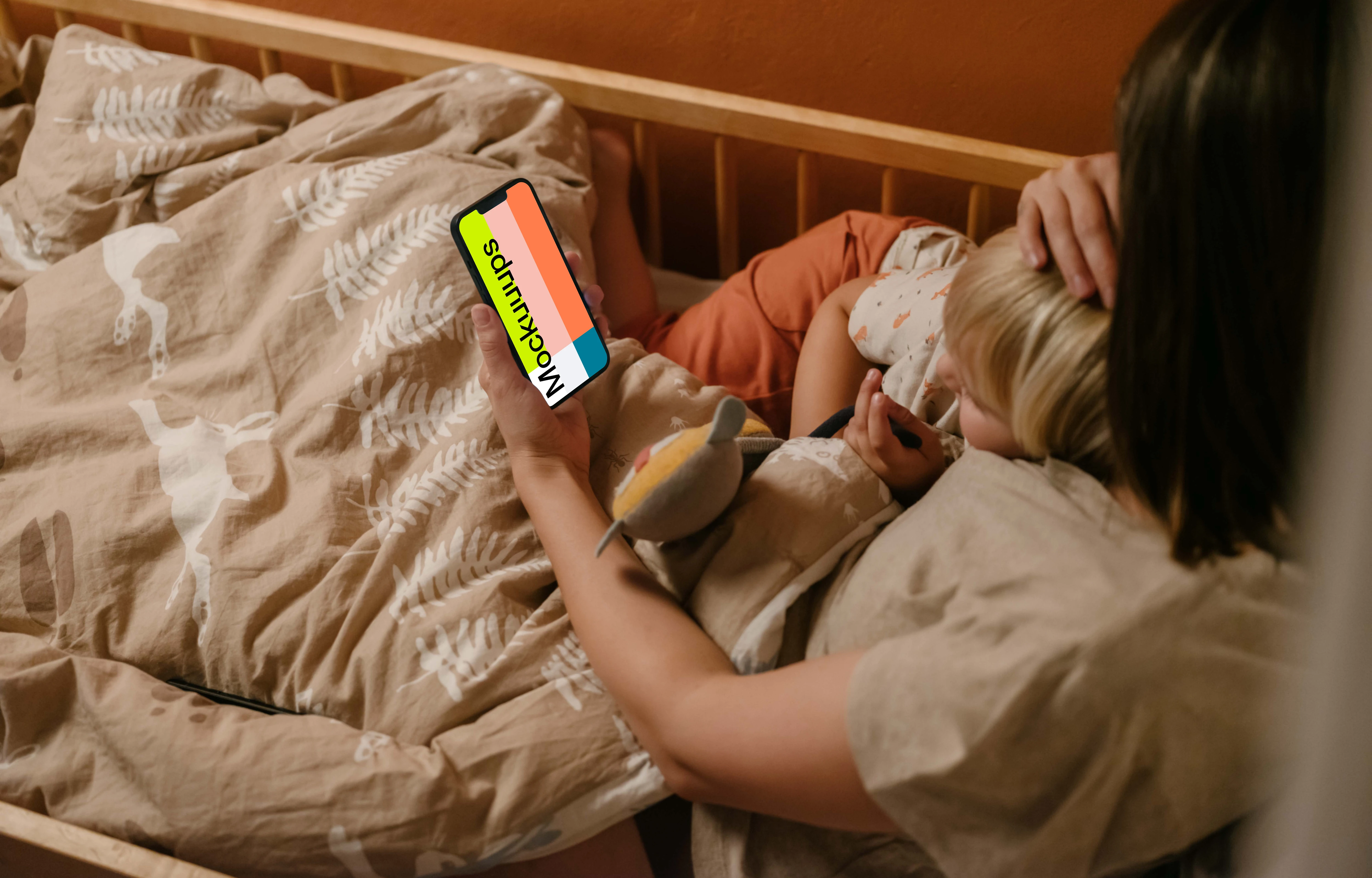 Person's hand holding an iPhone mockup