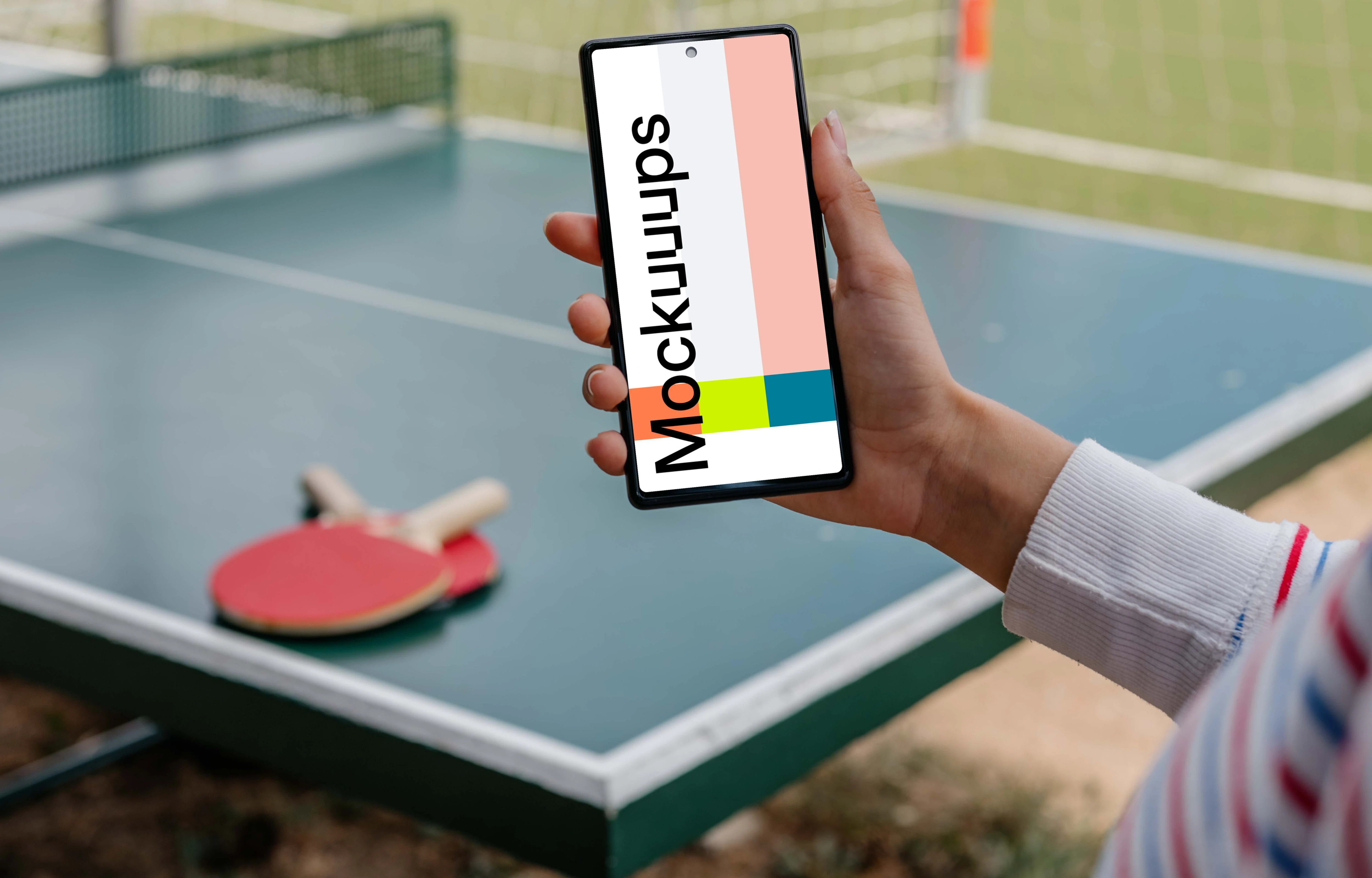Ping-pong player holding a phone mockup