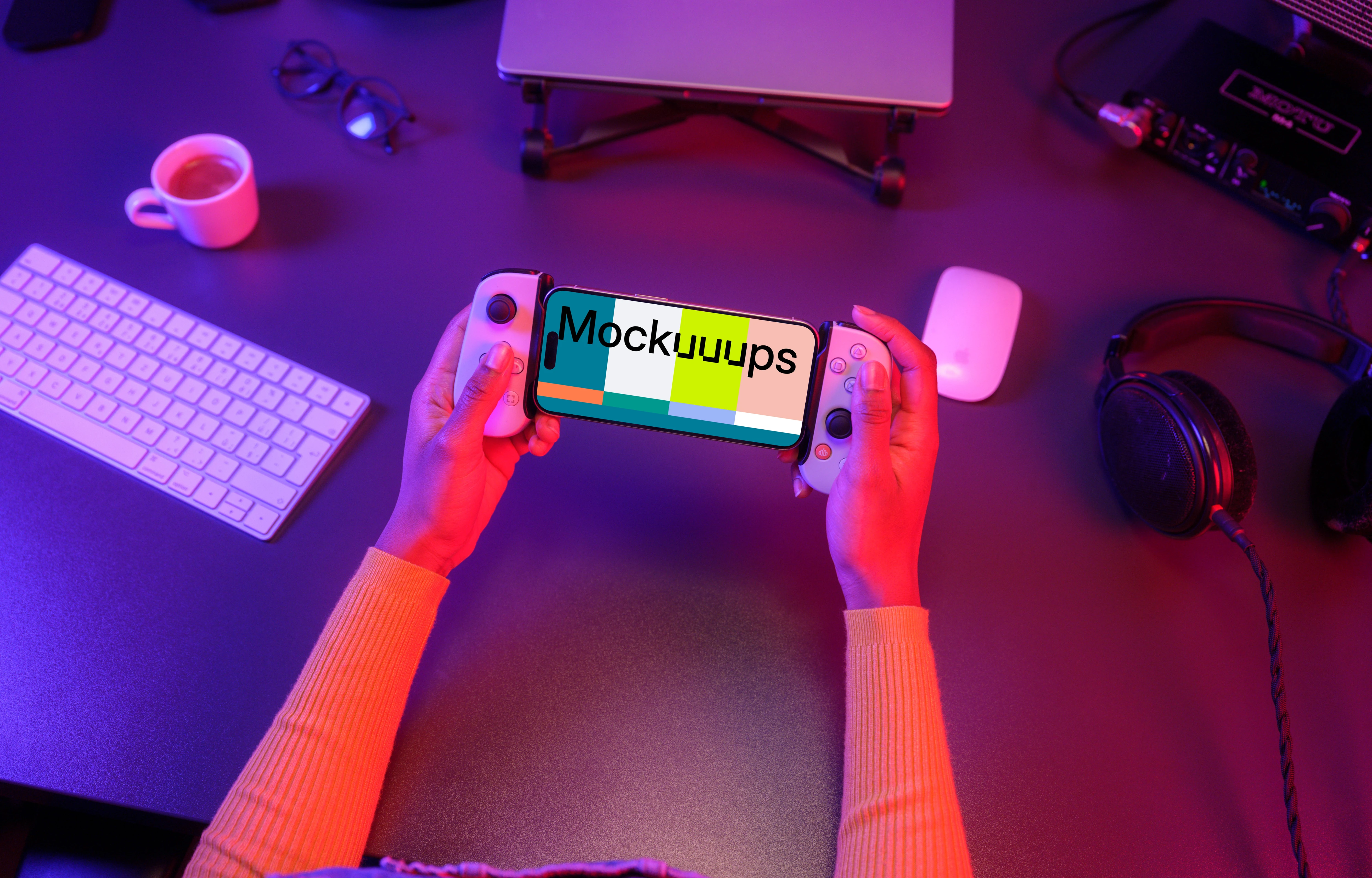 iPhone 15 Pro mockup in hand with gaming setup
