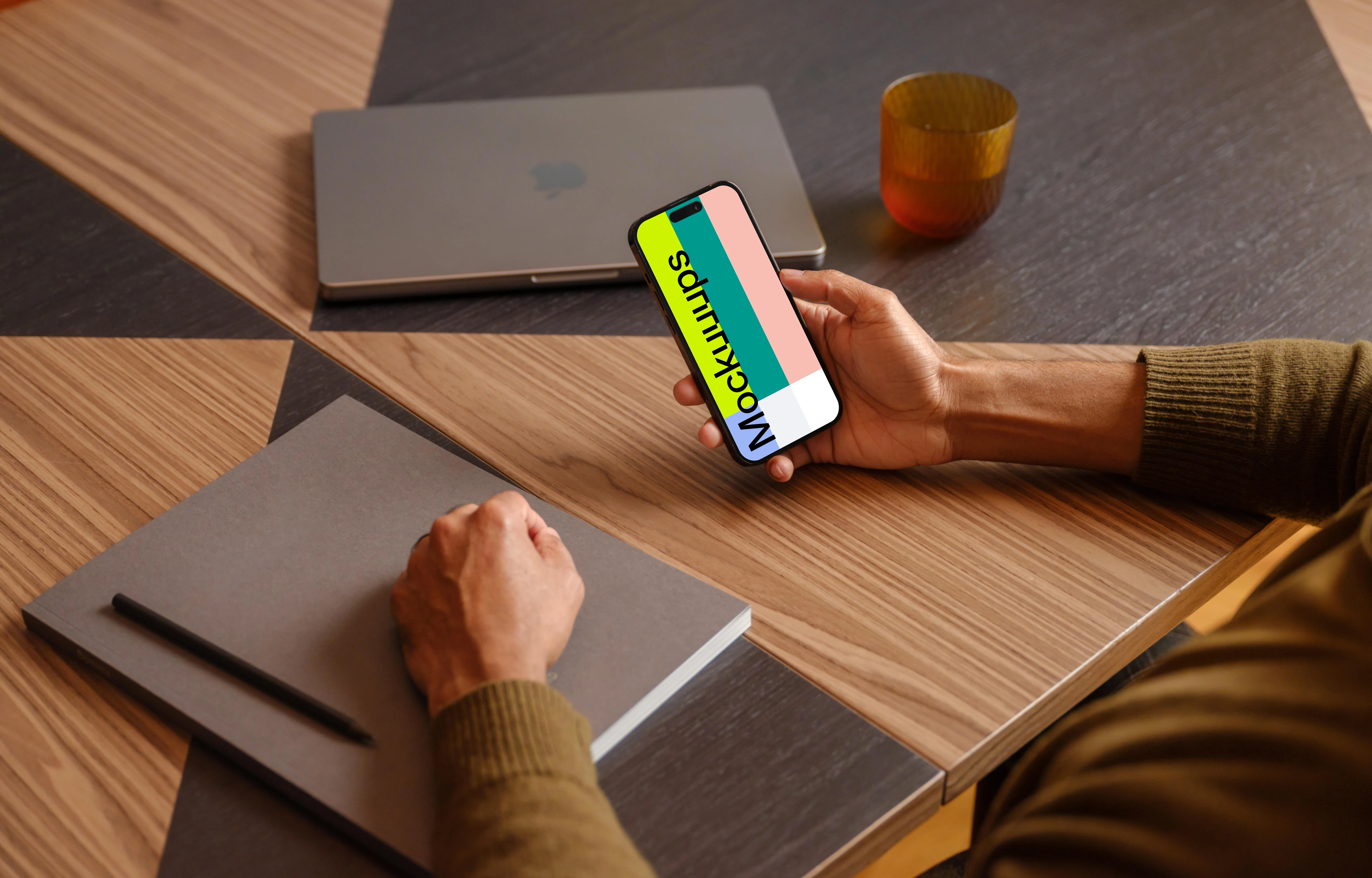 Man holding a iPhone mockup in the office environment