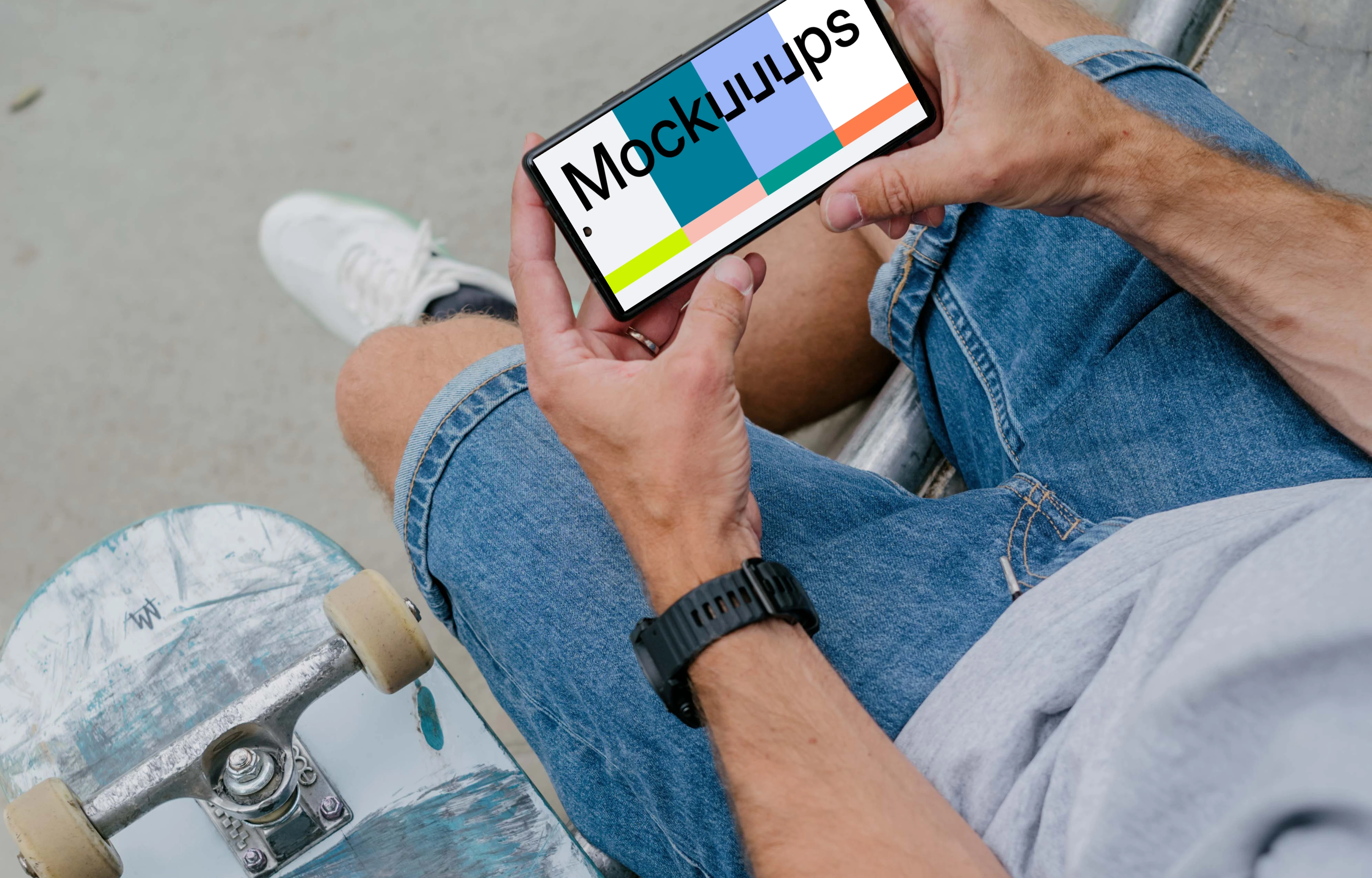 Skateboarder holding a phone mockup