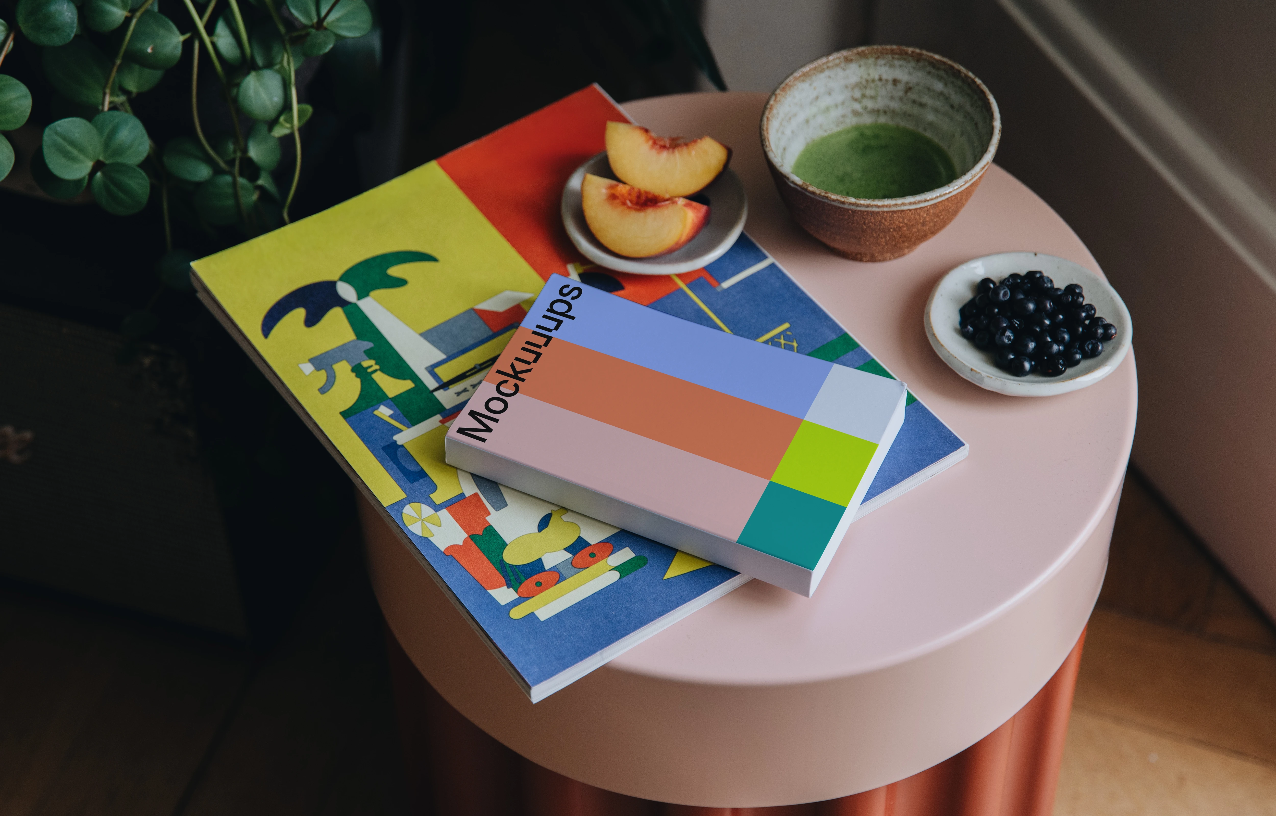 Softcover book mockup on a colorful table setup