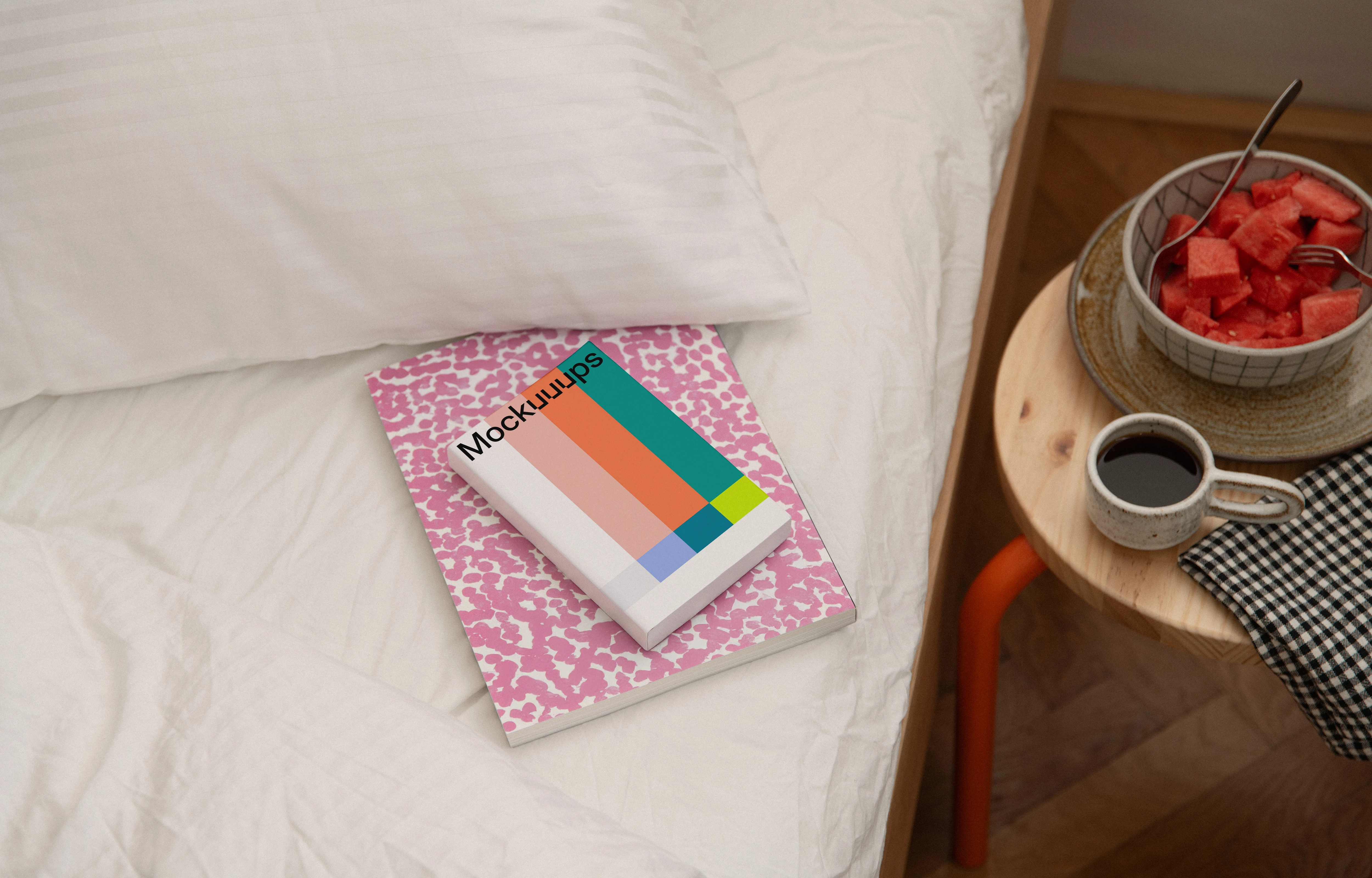 Softcover book mockup on a cozy bedside setup