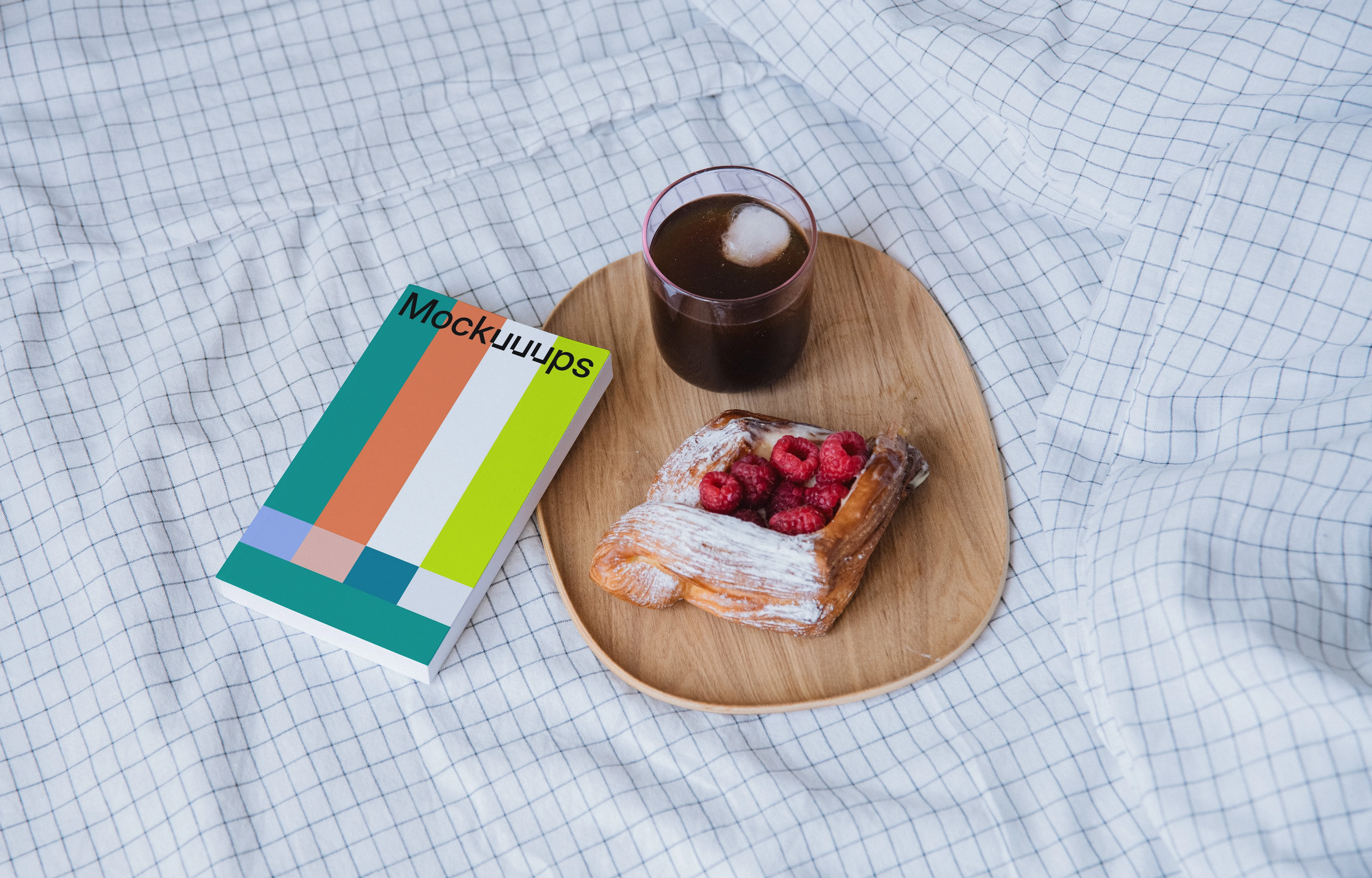 Softcover book mockup on a cozy breakfast setup