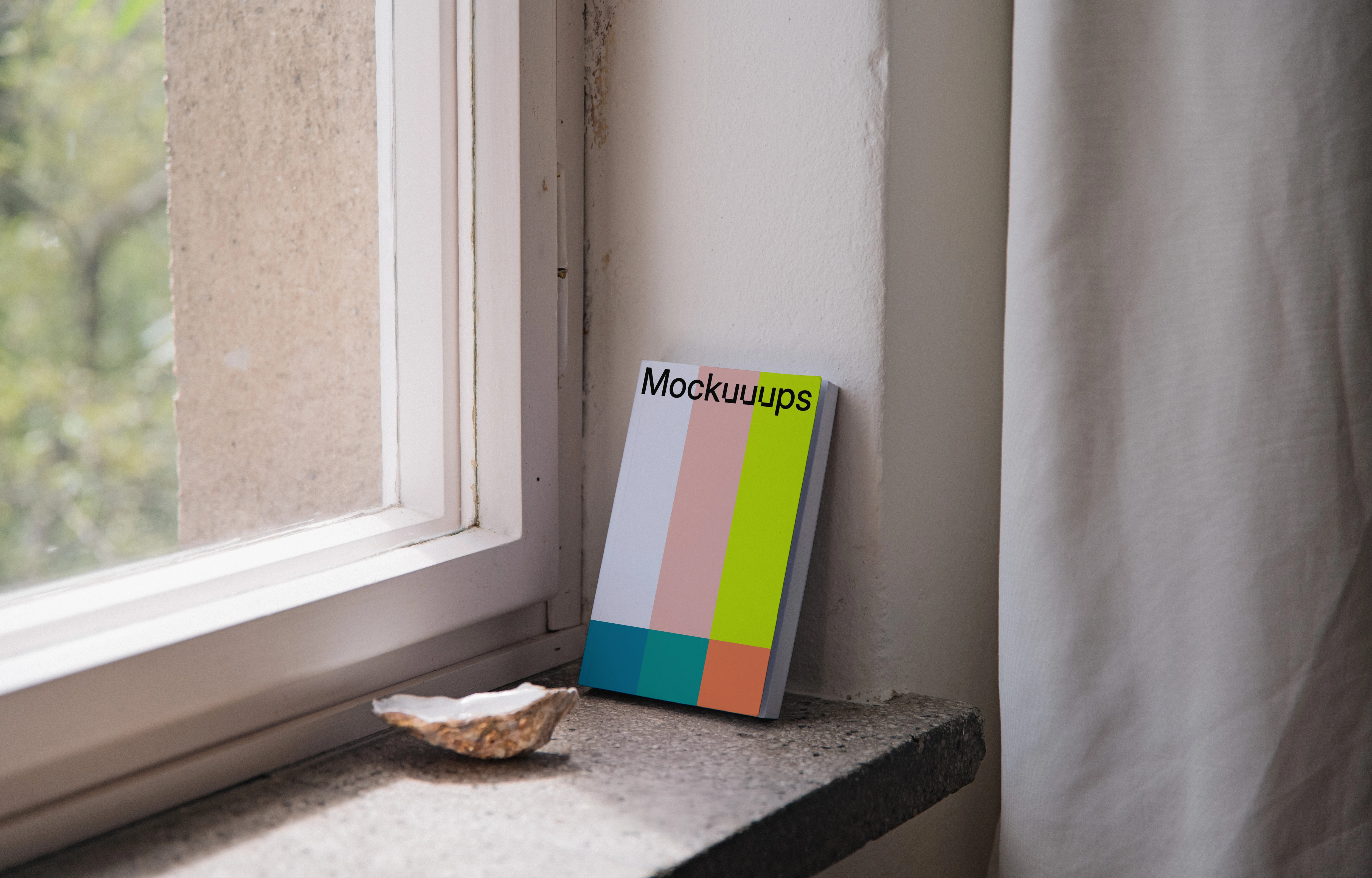 Softcover book mockup on a windowsill