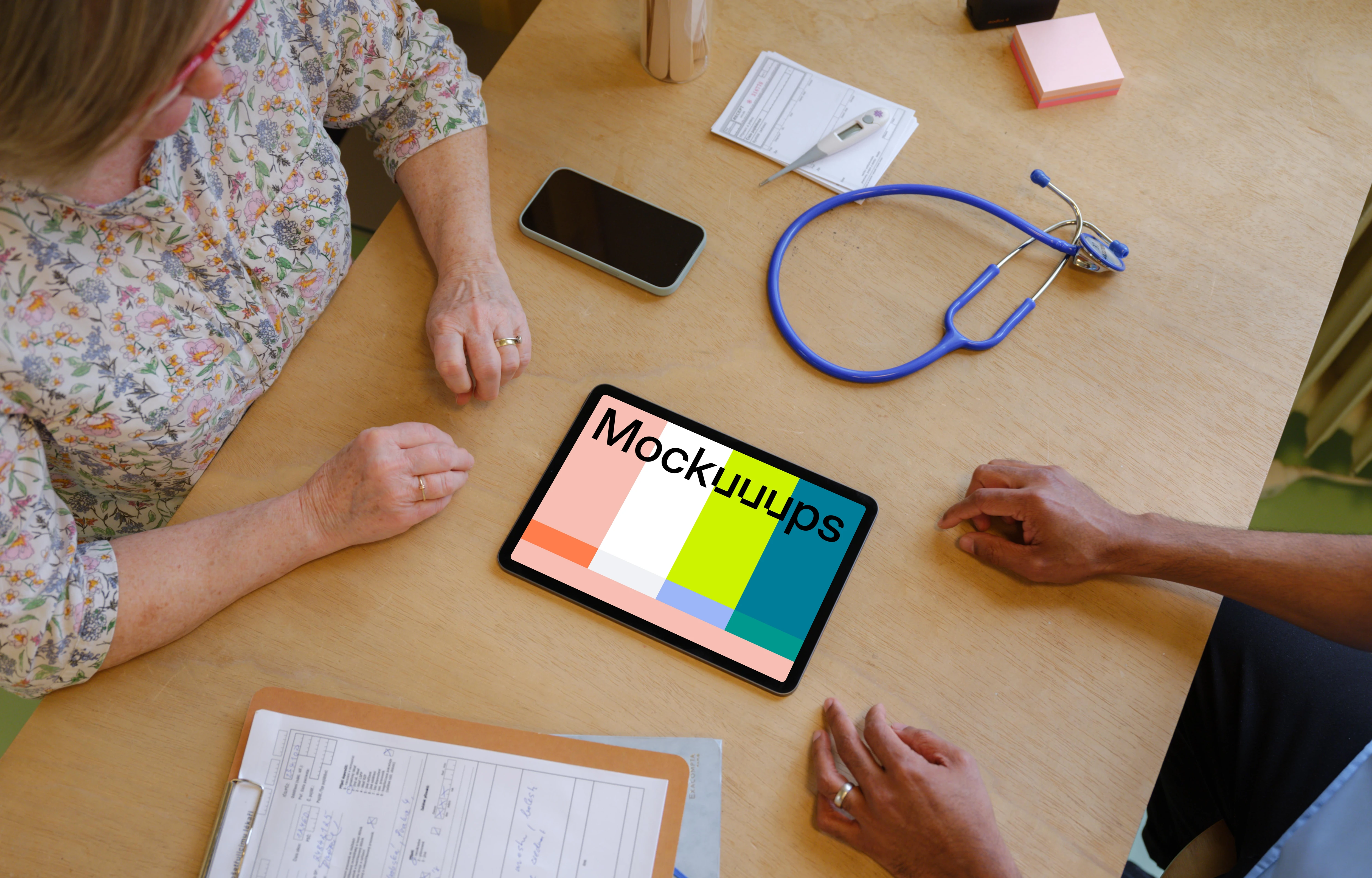 Tablet mockup between doctor and the patient