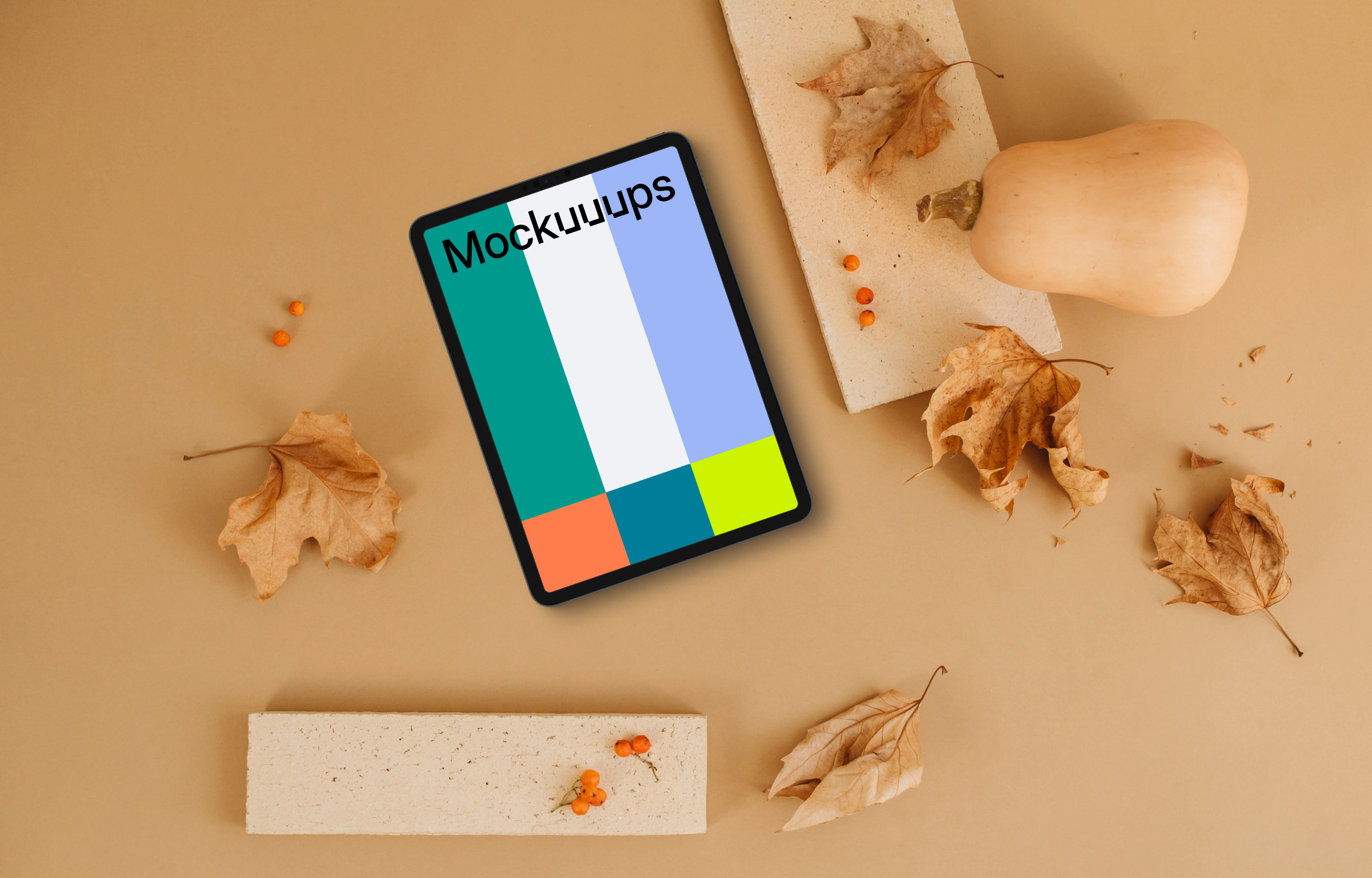 Tablet mockup next to the brick and pumpkin