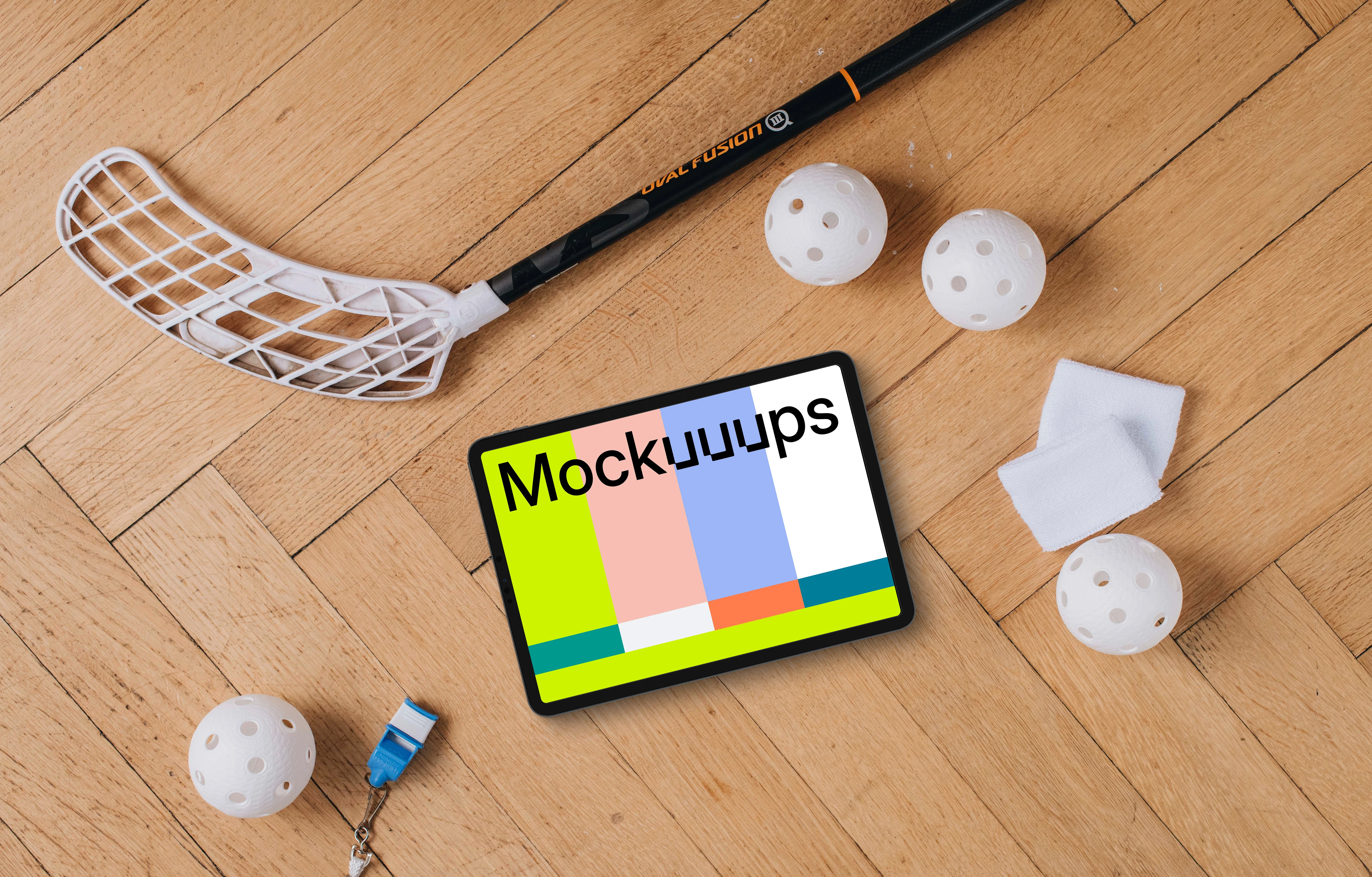Tablet mockup next to the floorball stick