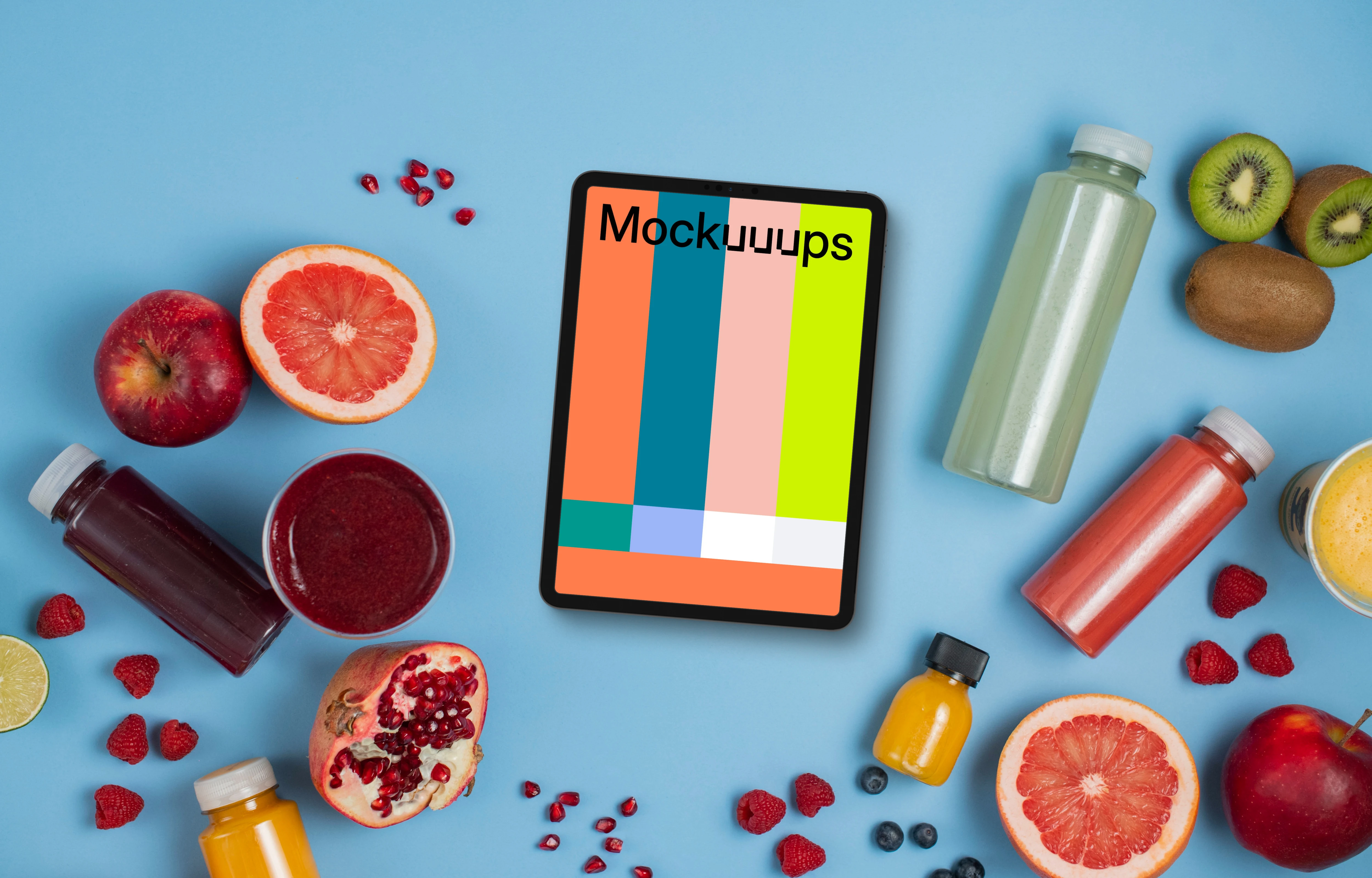 Tablet mockup surrounded by juices and fruit