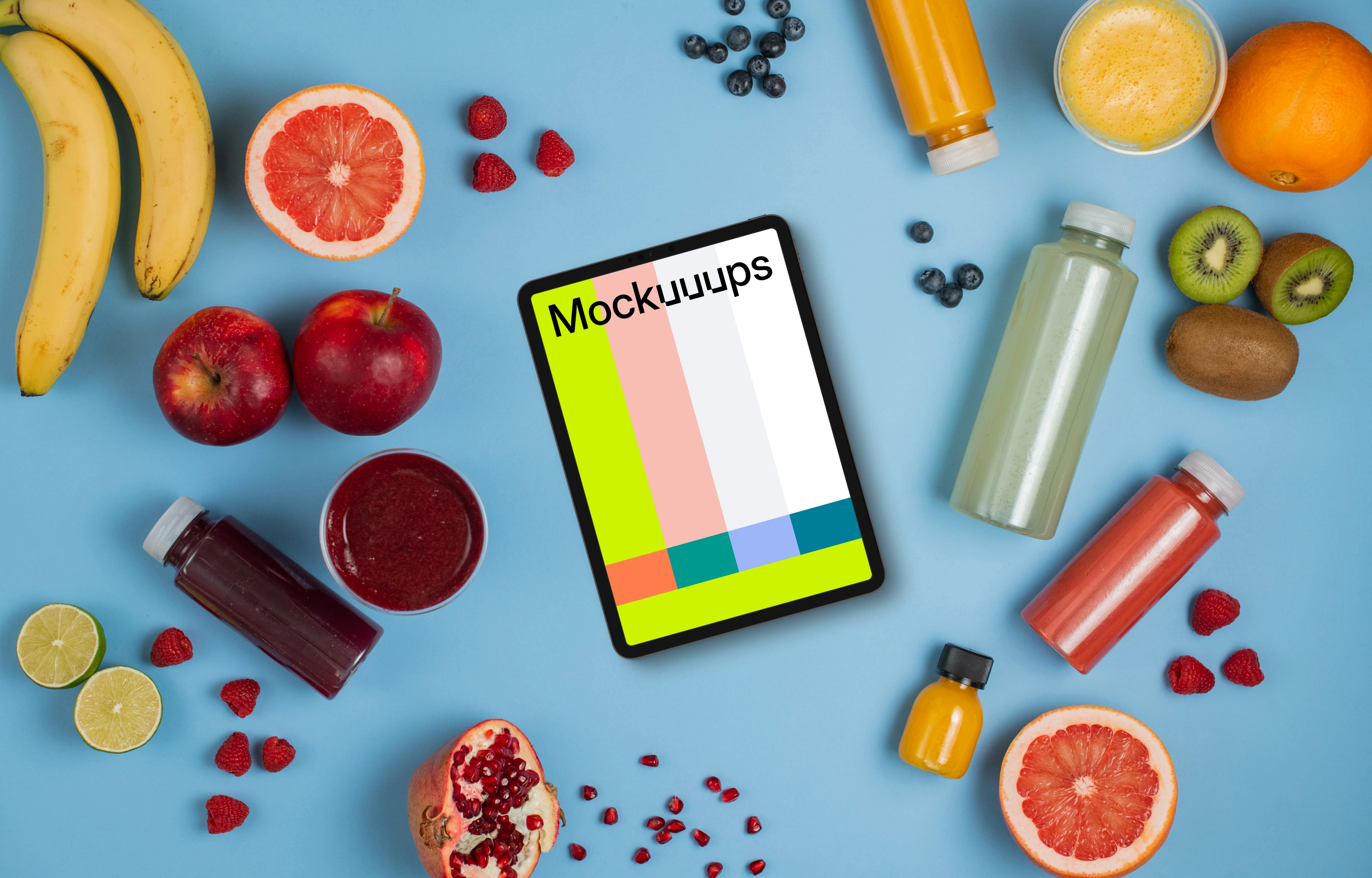 Tablet mockup surrounded by juices