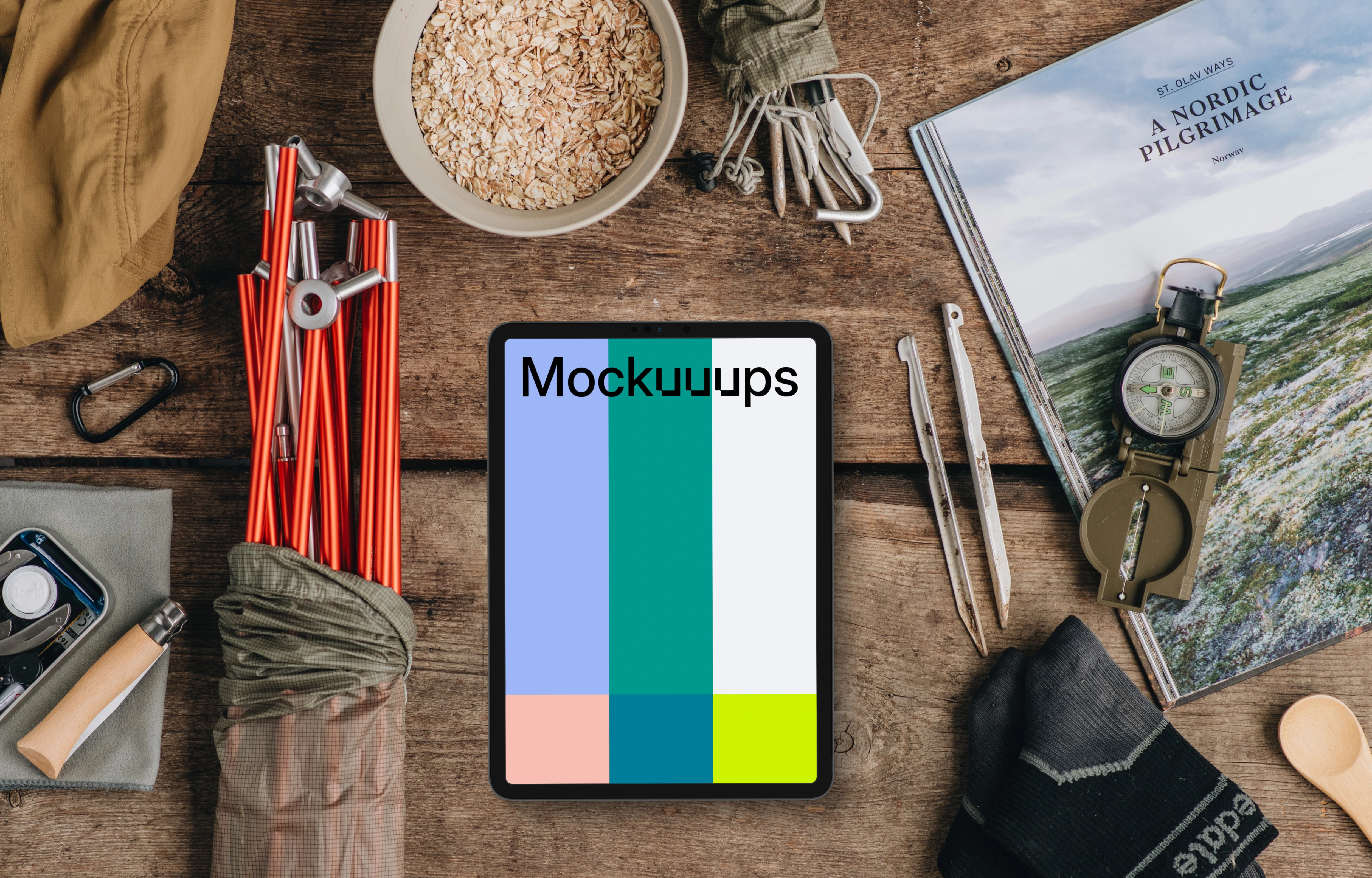 Tablet mockup with outdoor hike supplies