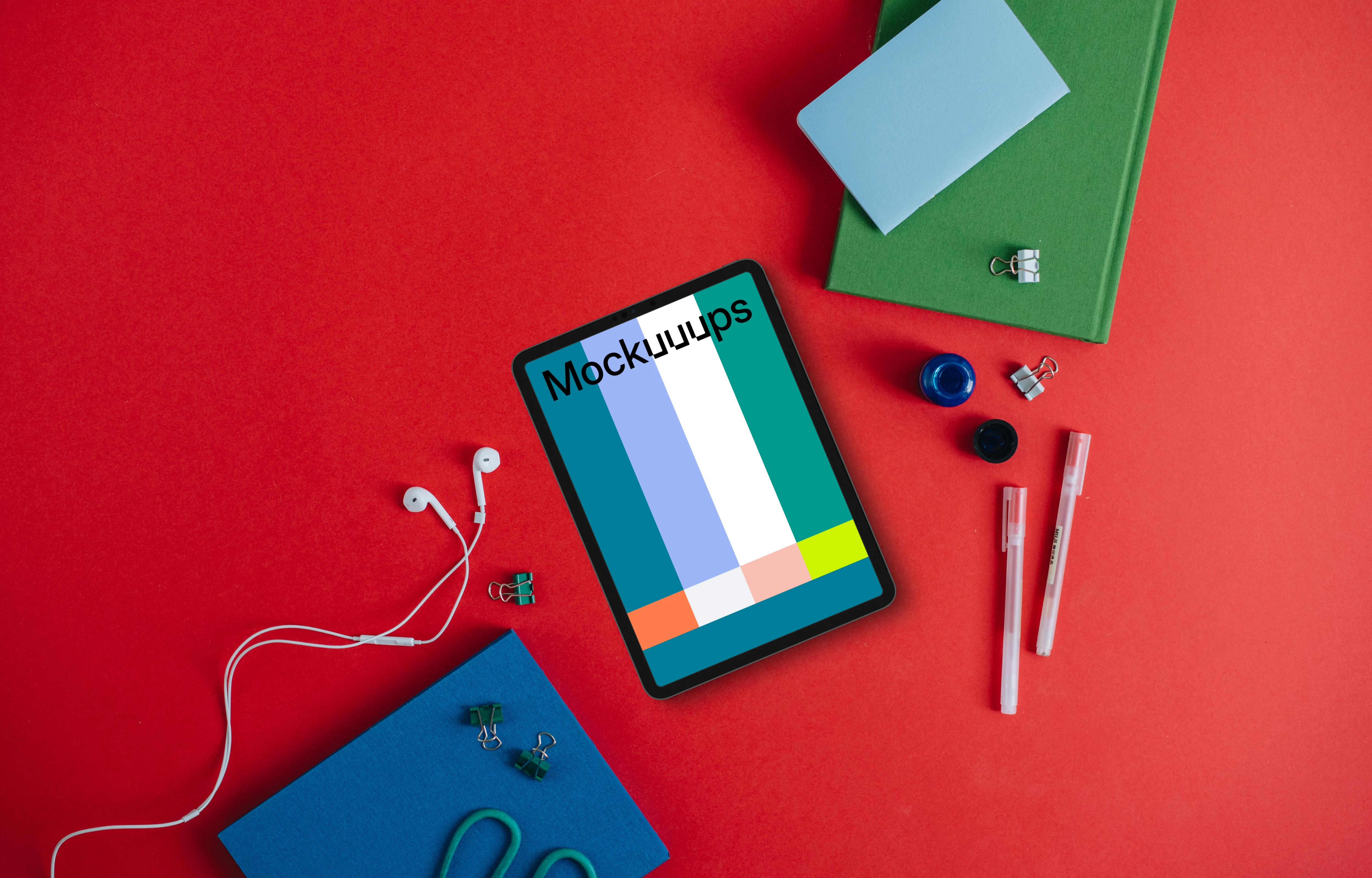 Tablet mockup with pencils and notebook on the side
