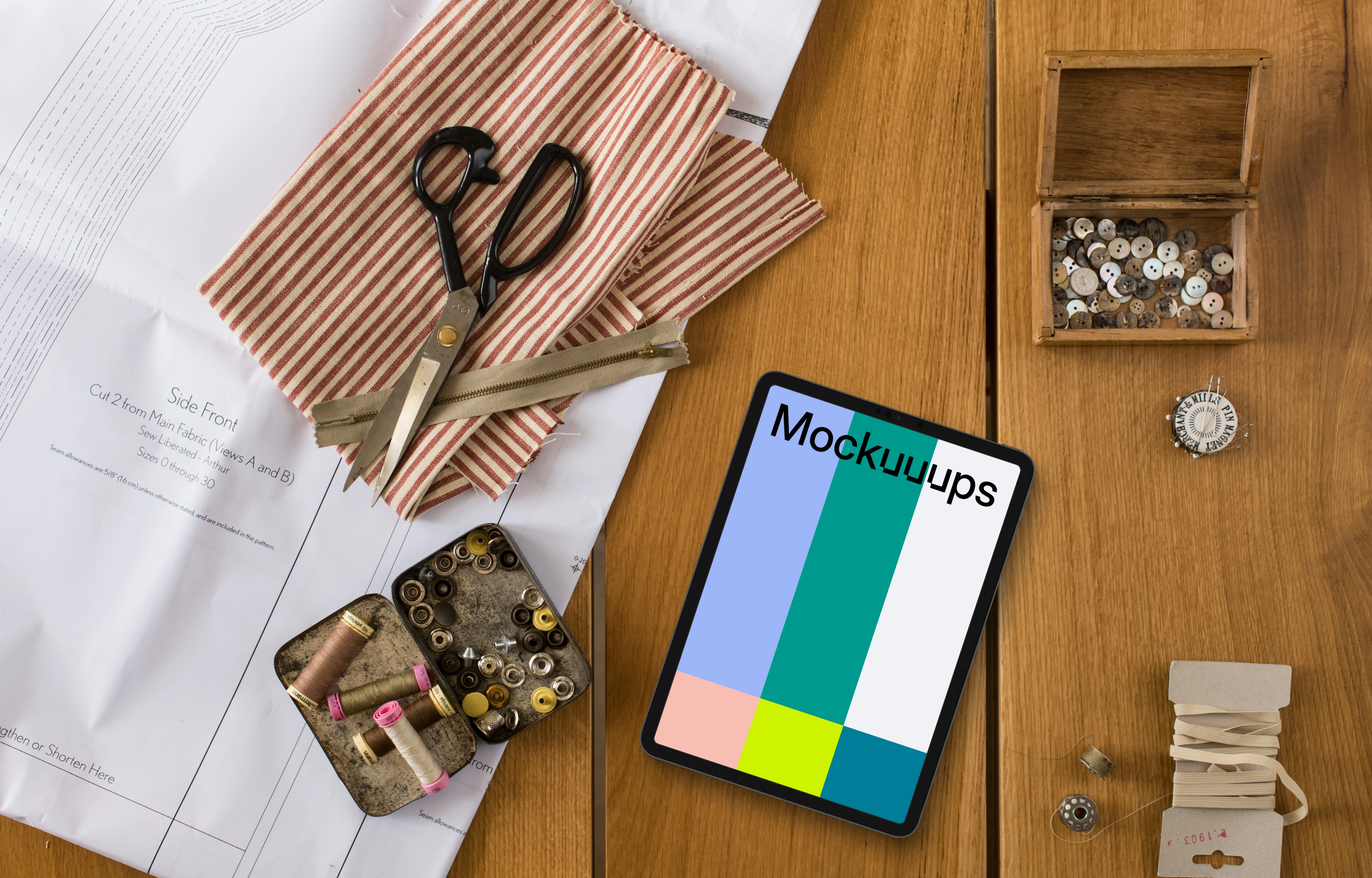 Tablet mockup with sewing scissors on the side