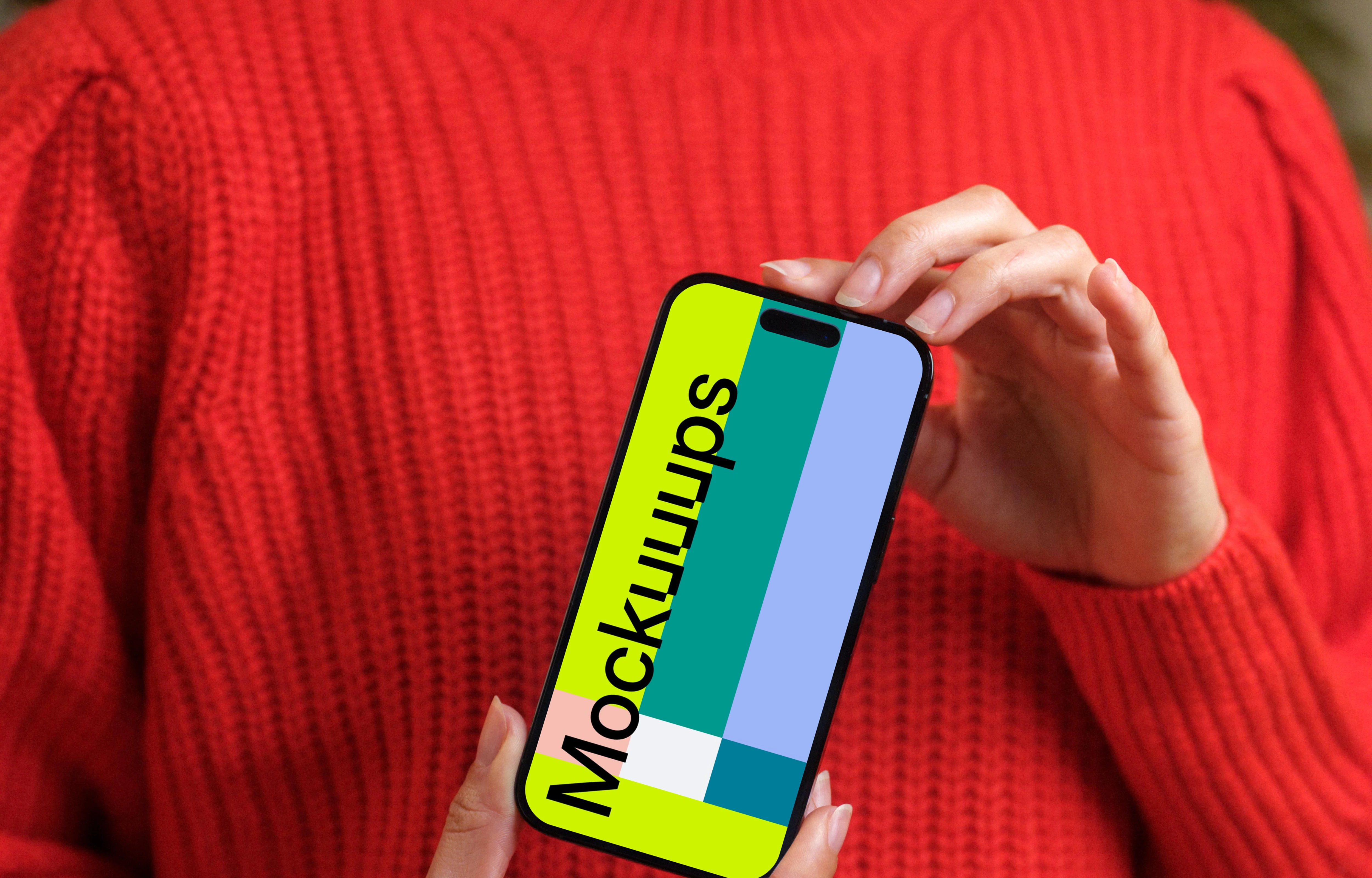 Woman in red sweater holding an iPhone 14 Pro mockup