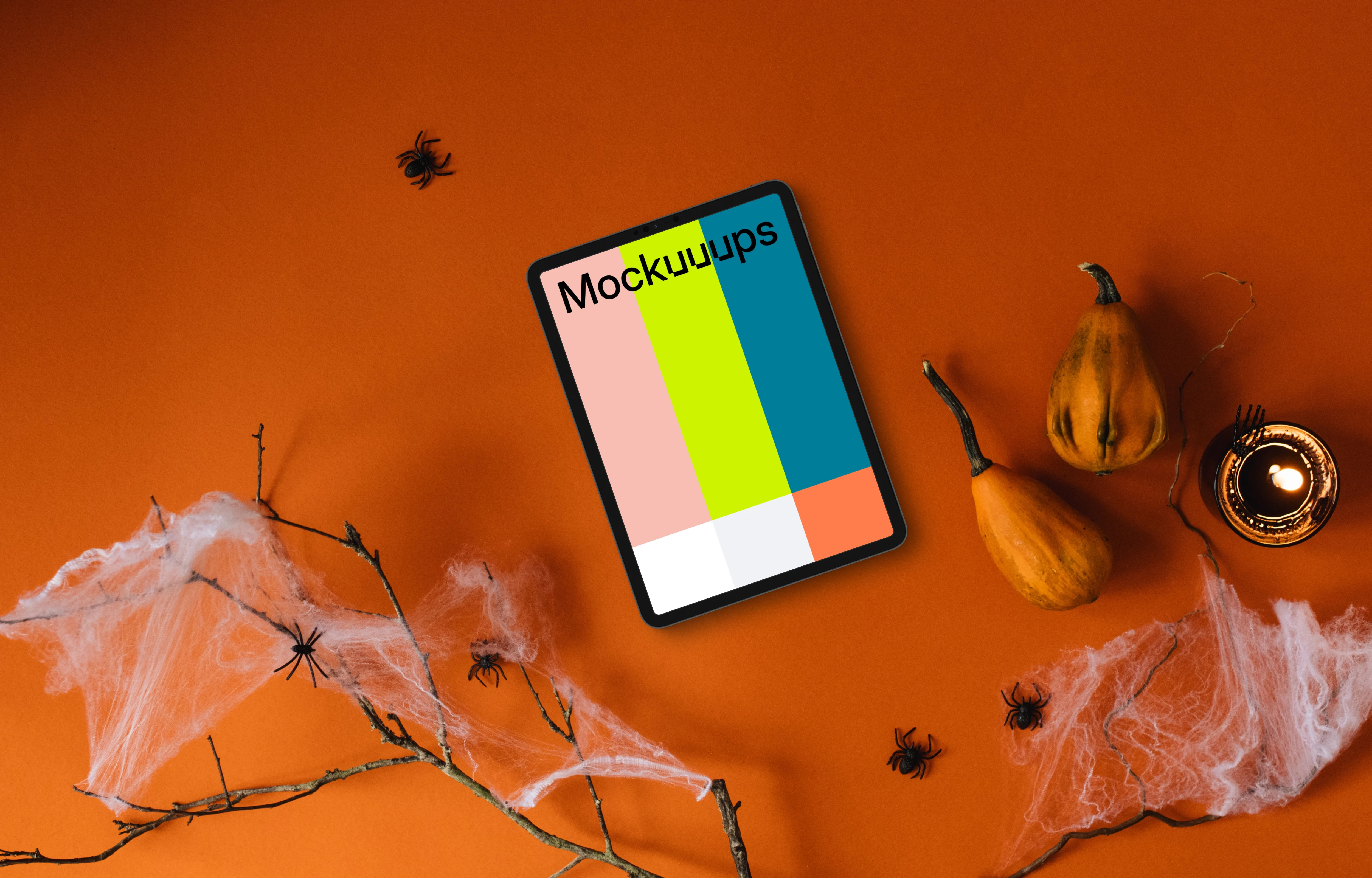 Top view of halloween presentation template with a tablet