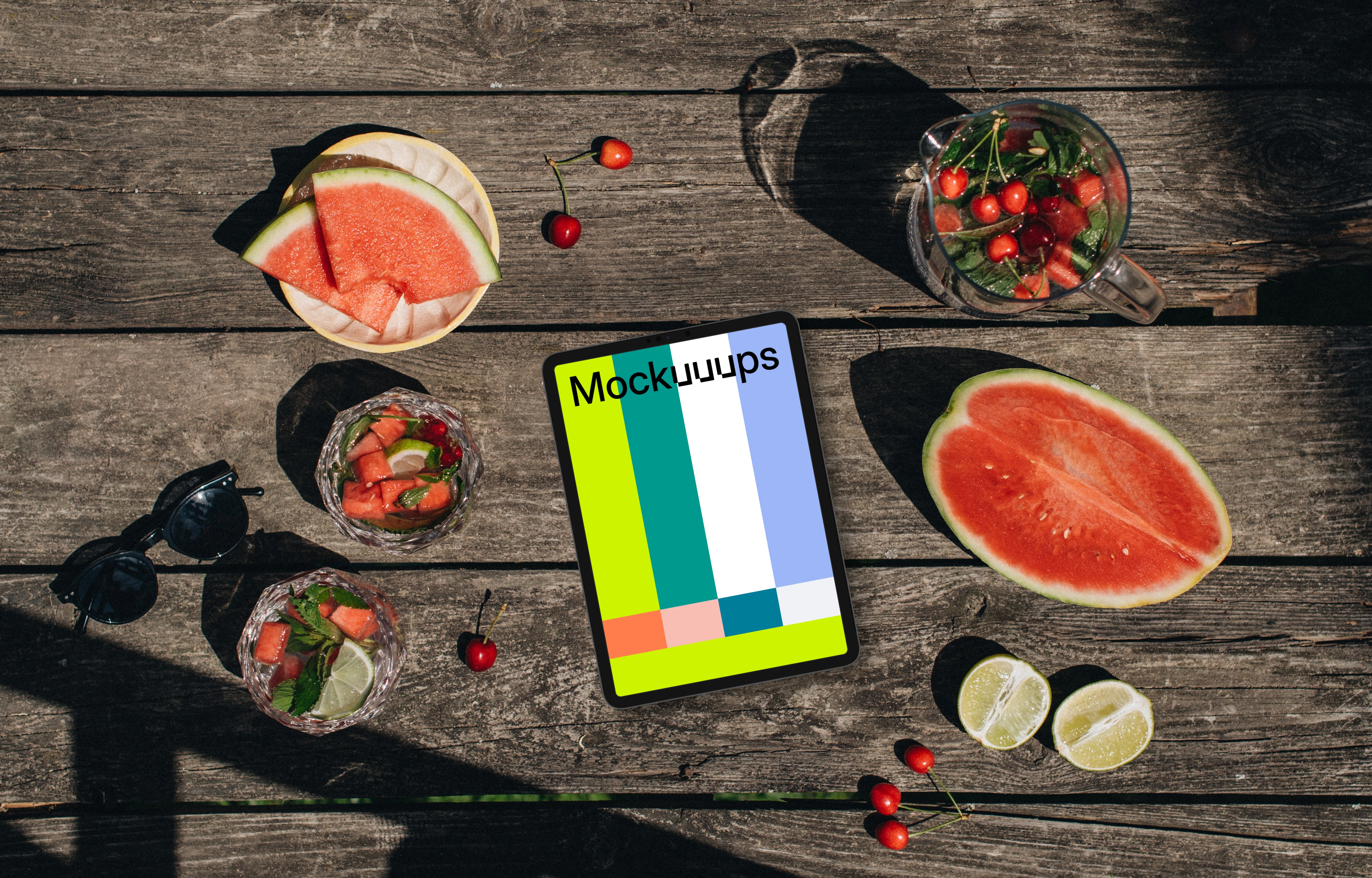 Top view of tablet mockup next to a watermeloon