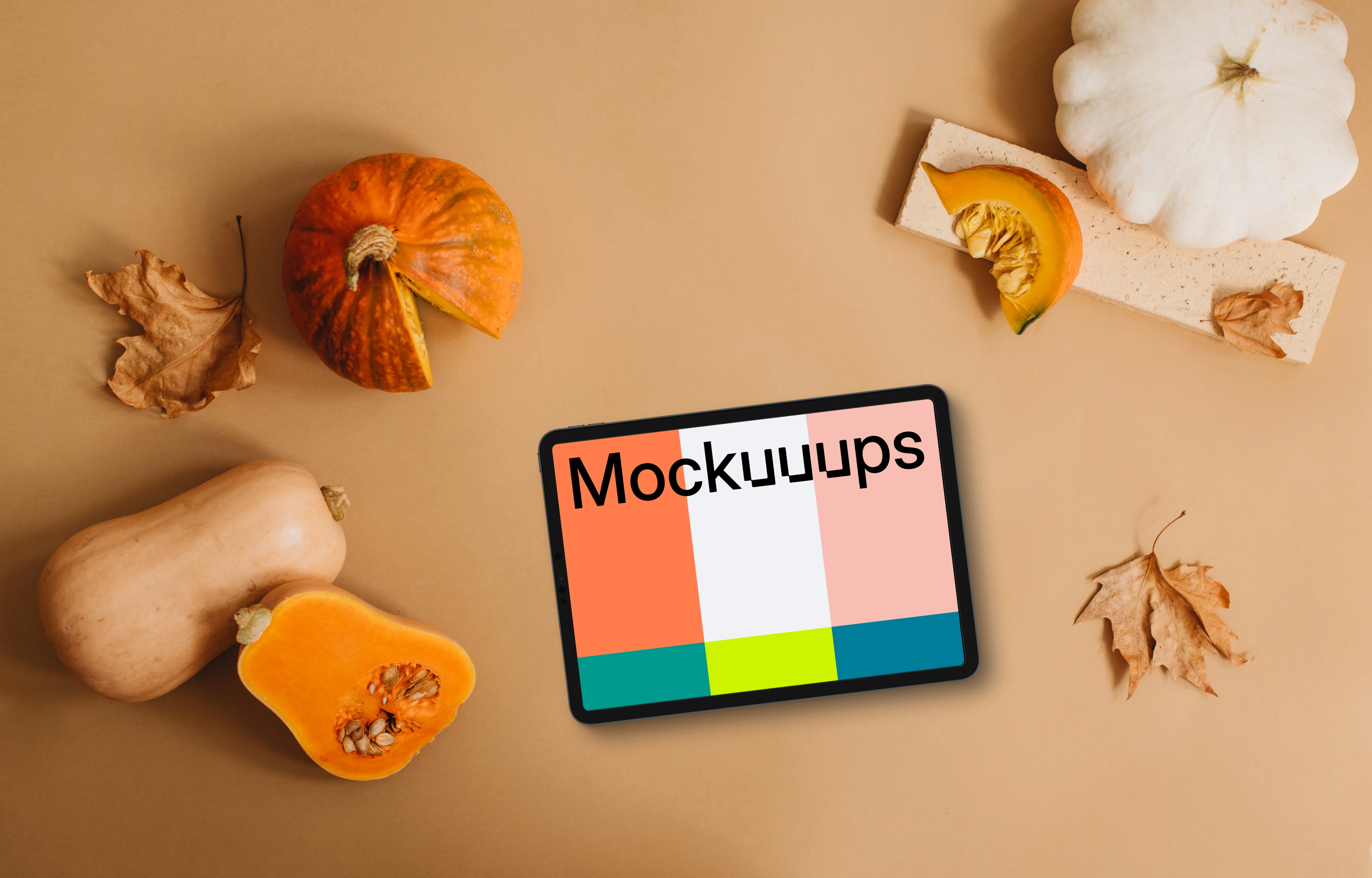 Top view of tablet mockup with pumpkins