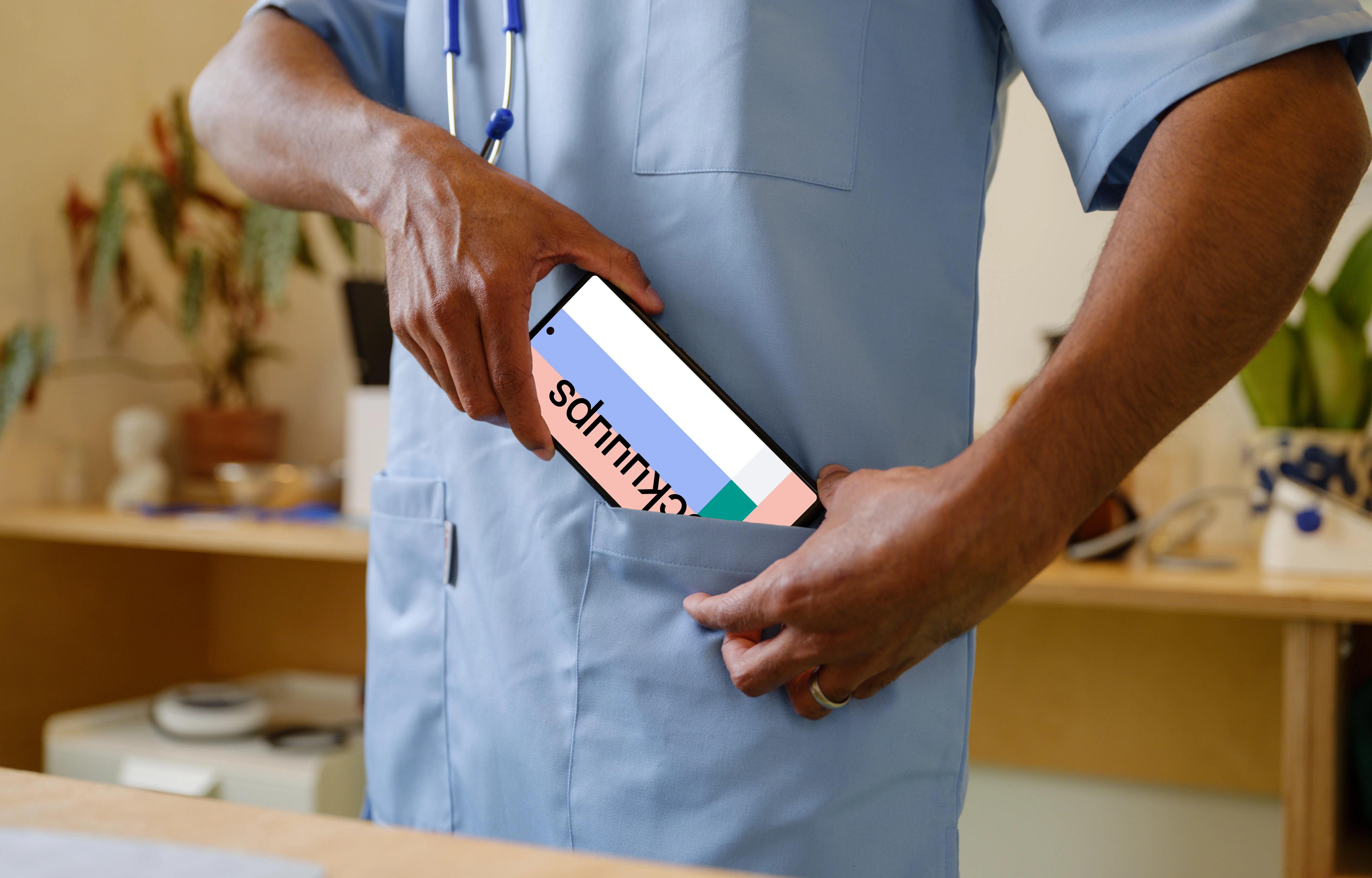 Doctor taking phone to the pocket