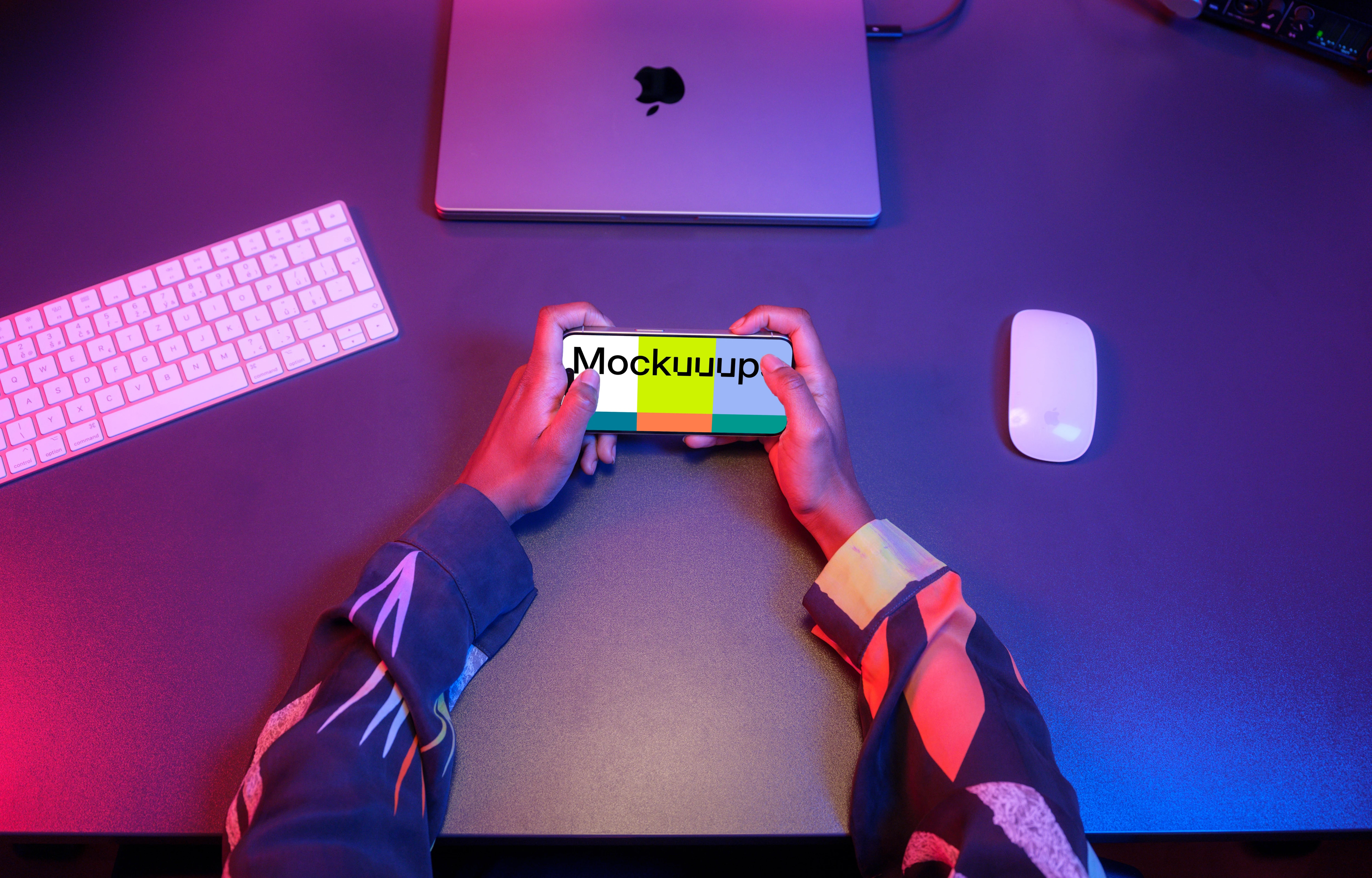 iPhone 15 Pro mockup surrounded by gaming setup
