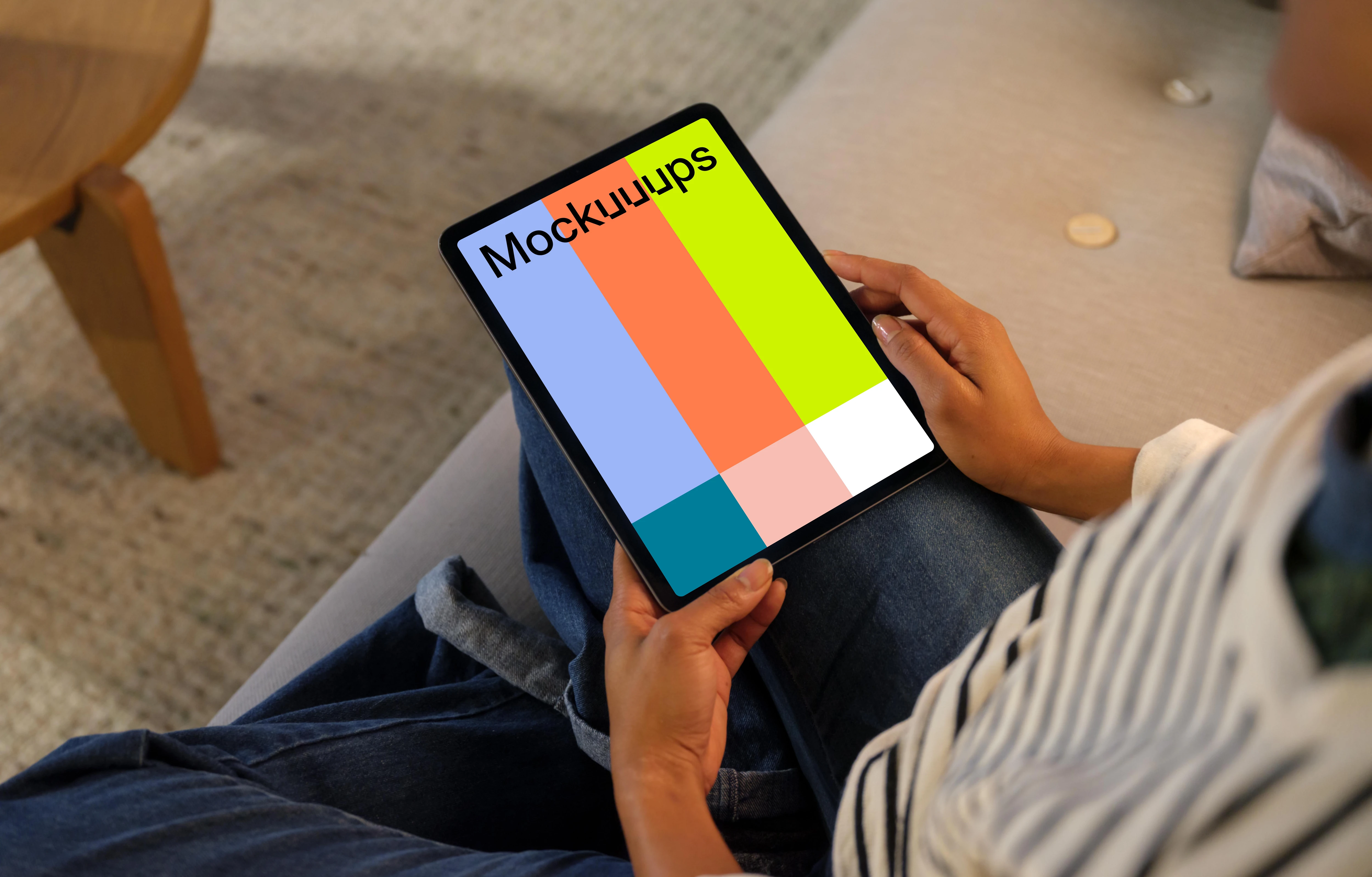 Woman holding an iPad Air mockup in cozy place