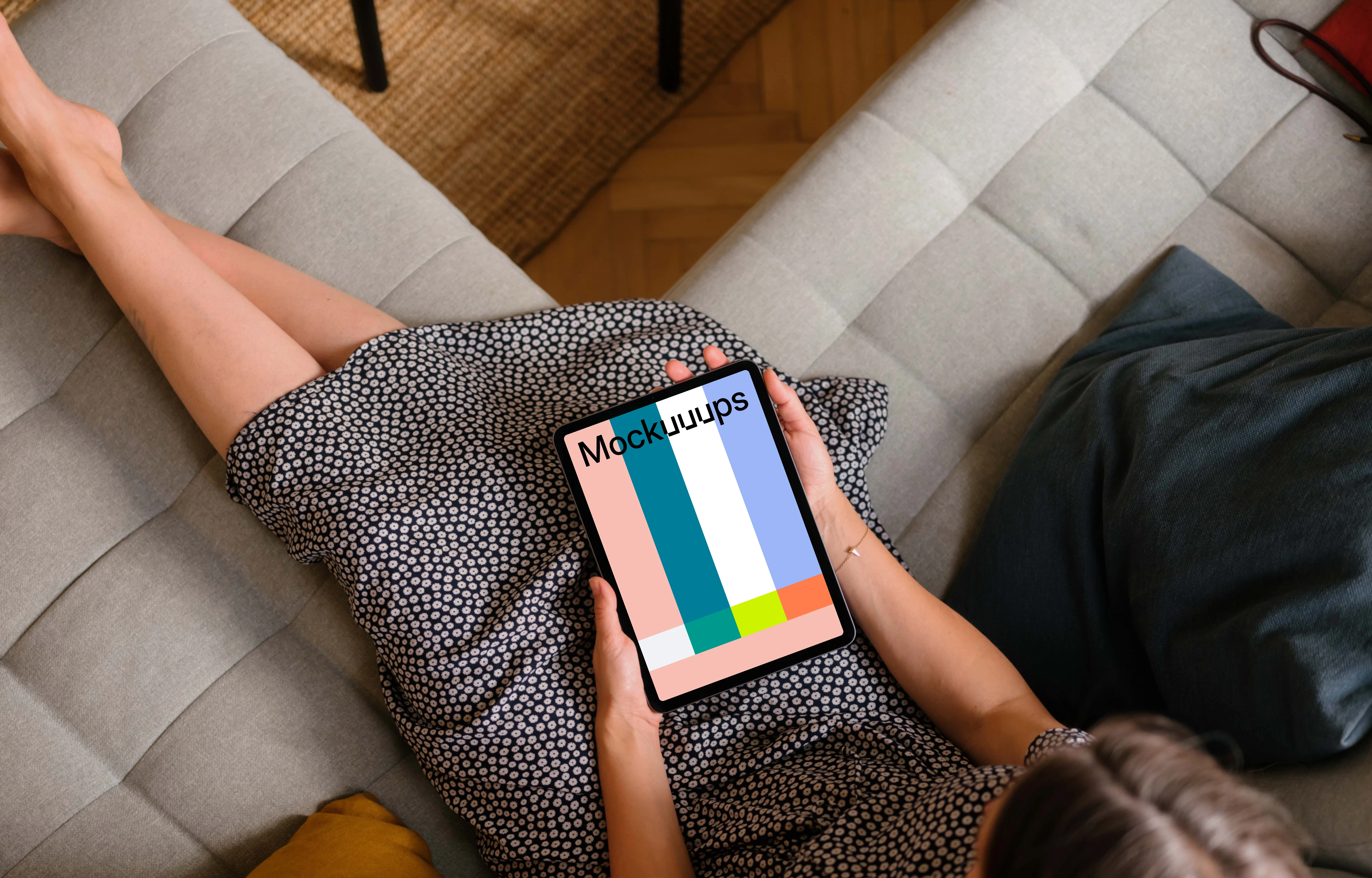 Woman holding an iPad Air mockup