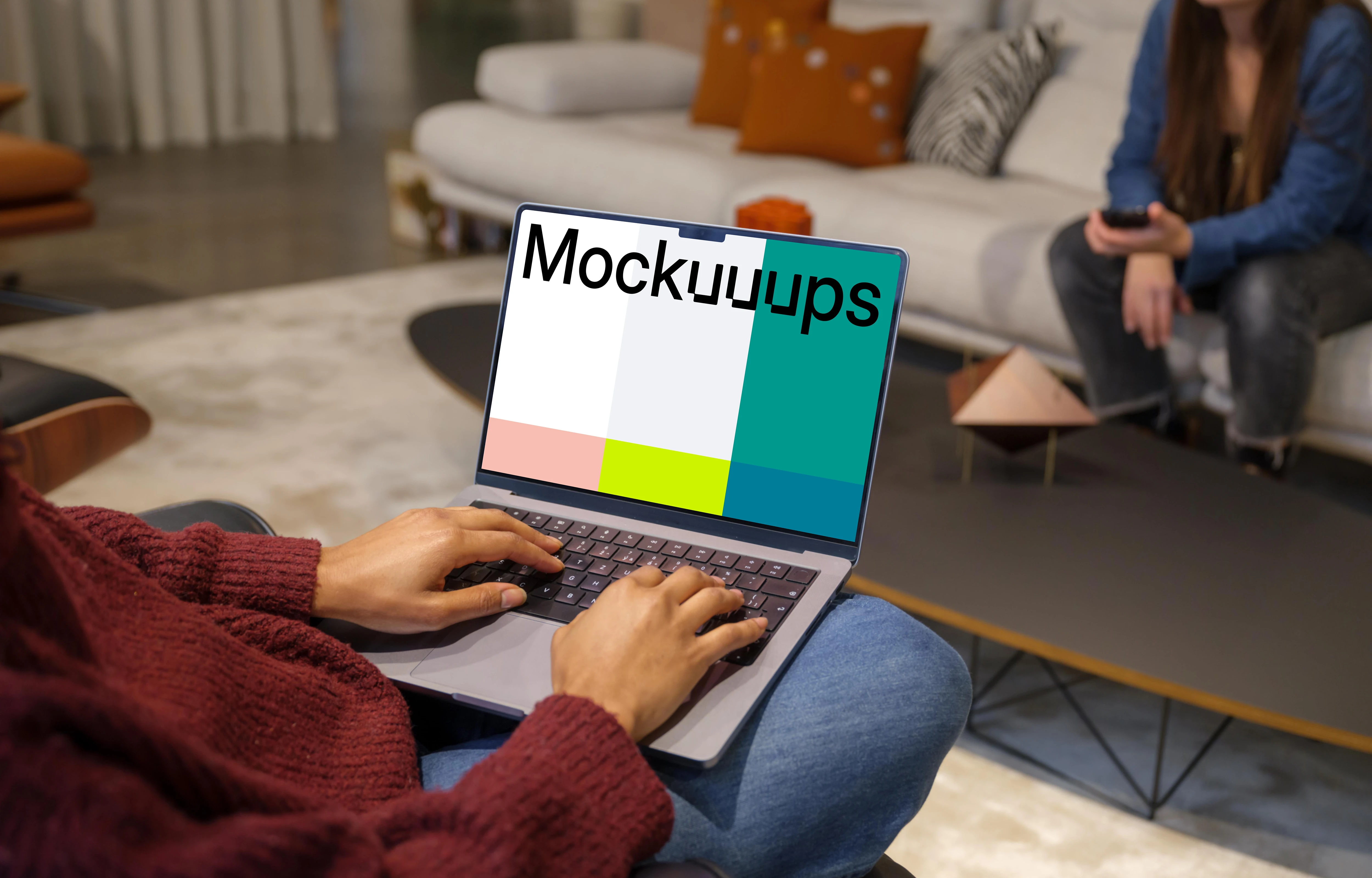 Woman in red sweater typing on a Mac Book Pro 14 mockup