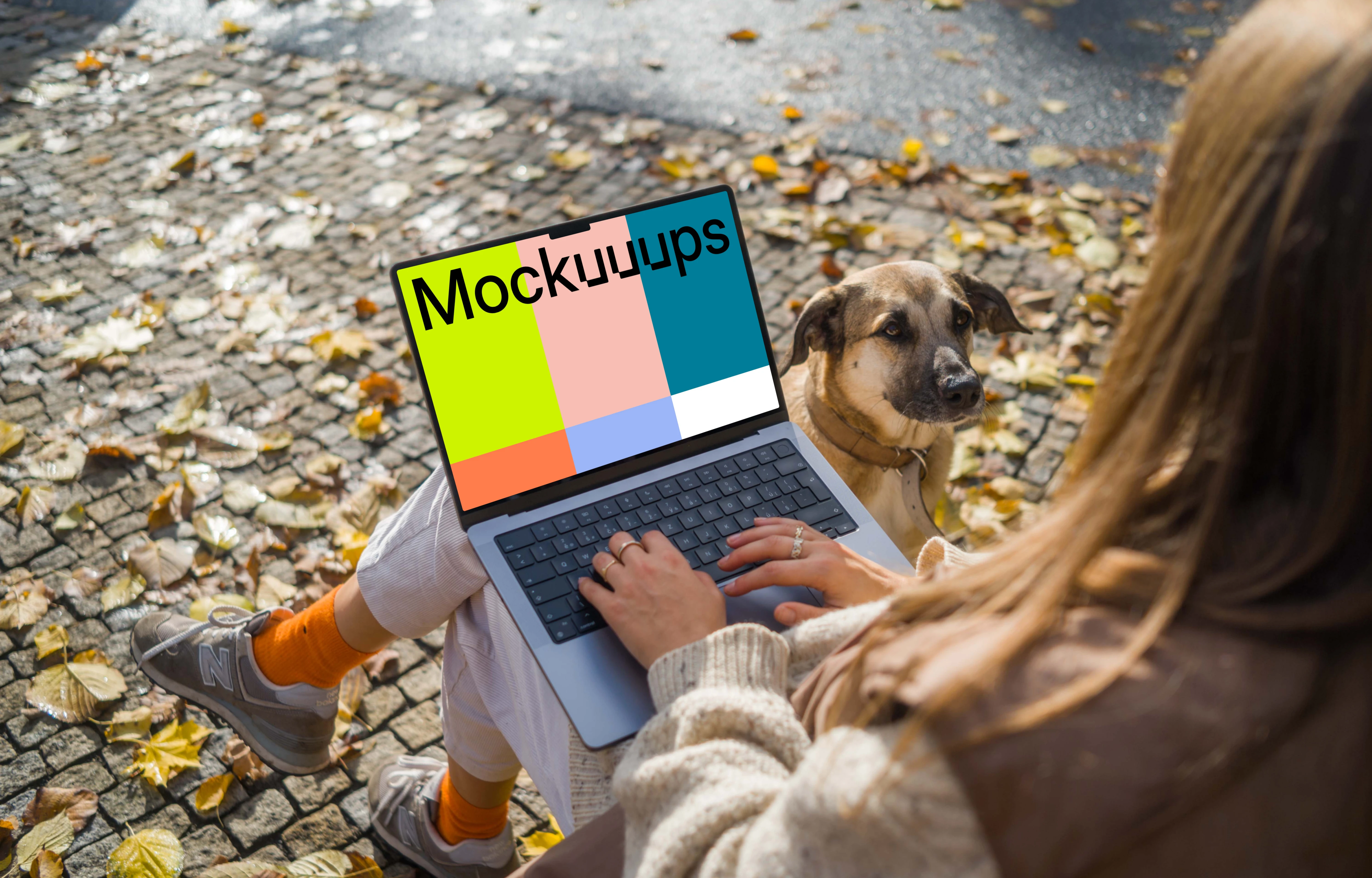 Woman sitting next to the dog with a MacBook Pro 14 mockup