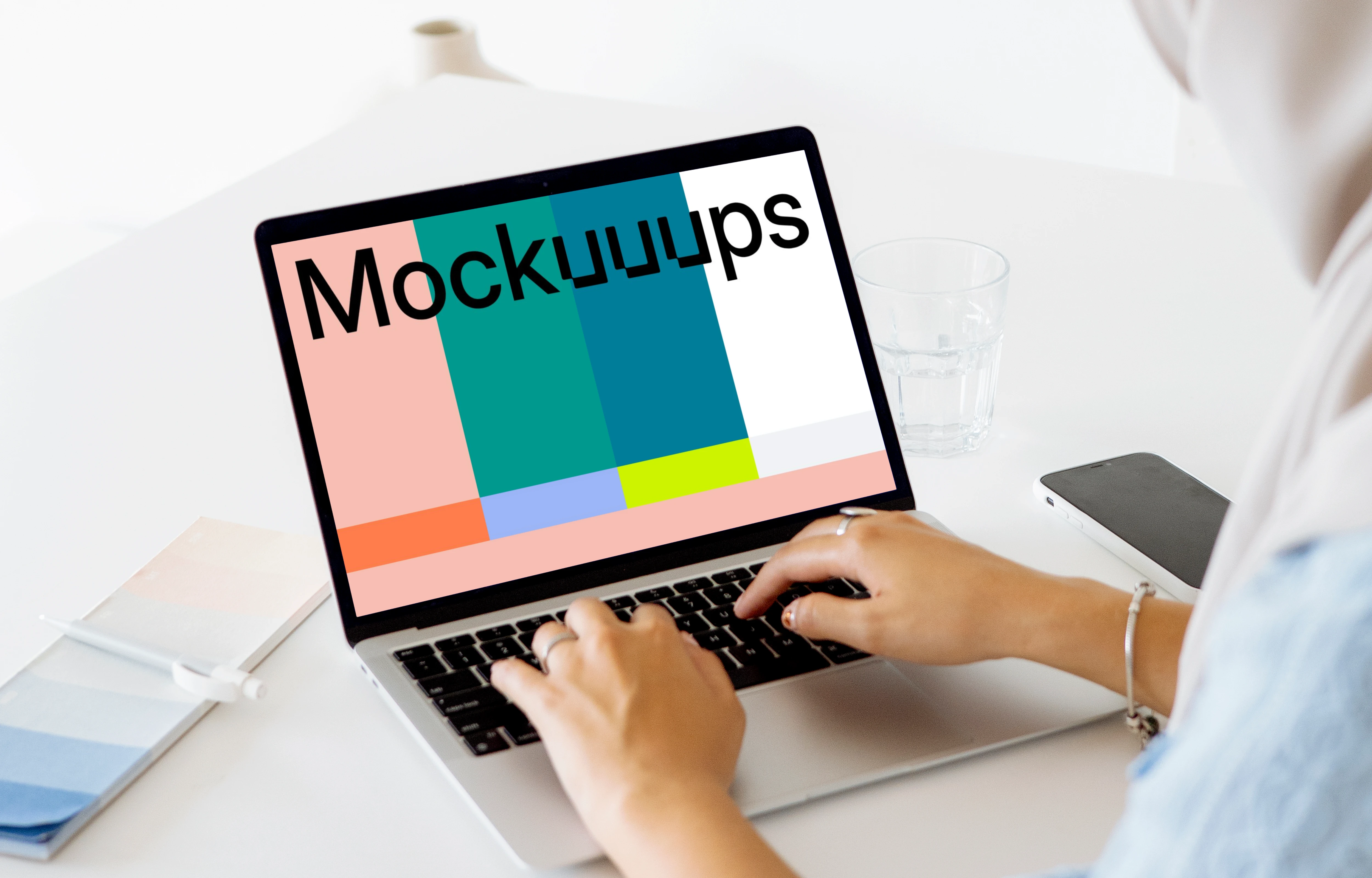 Woman typing on a MacBook Pro mockup