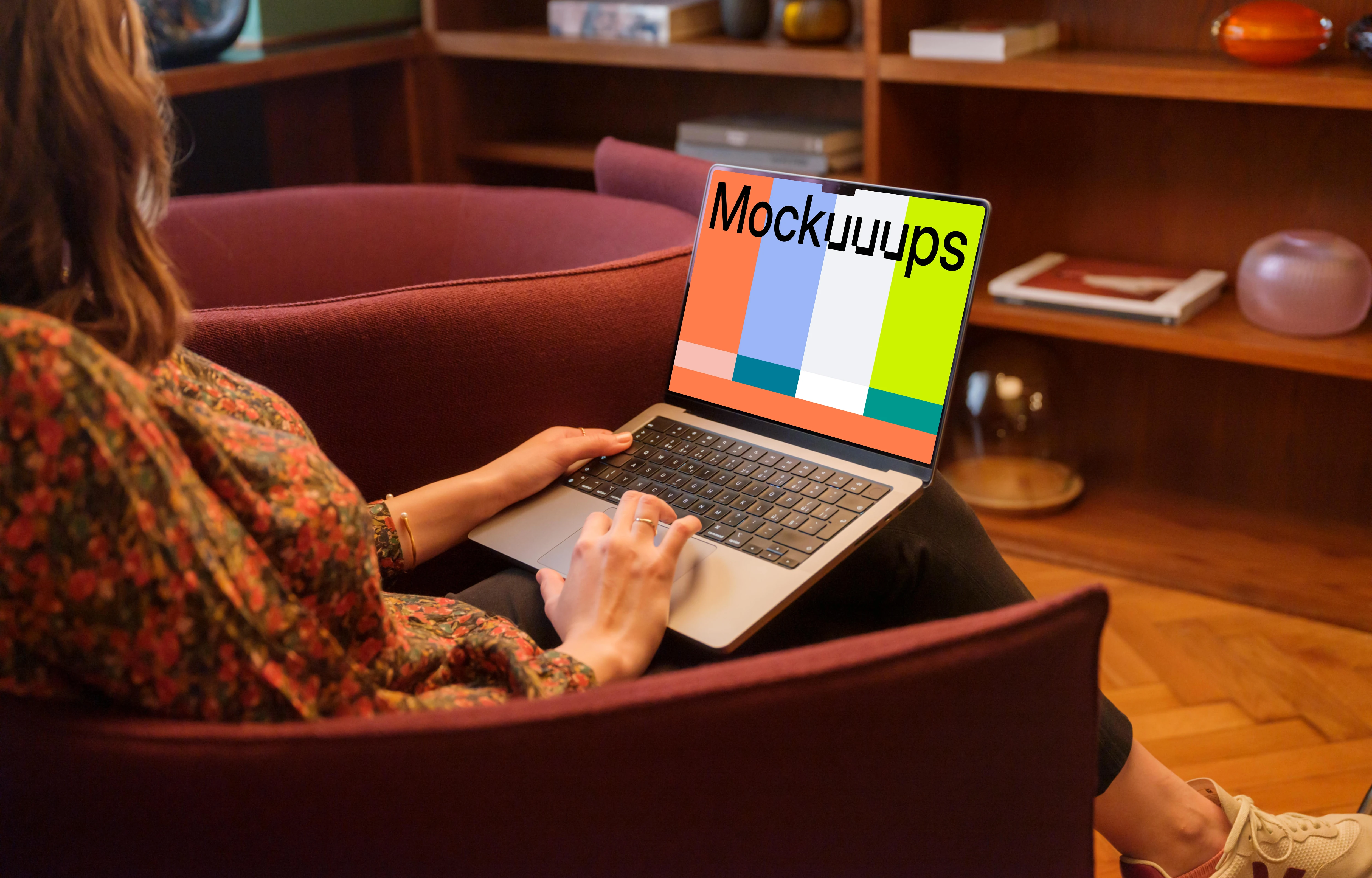 Woman working on the MacBook Pro mockup in office environment