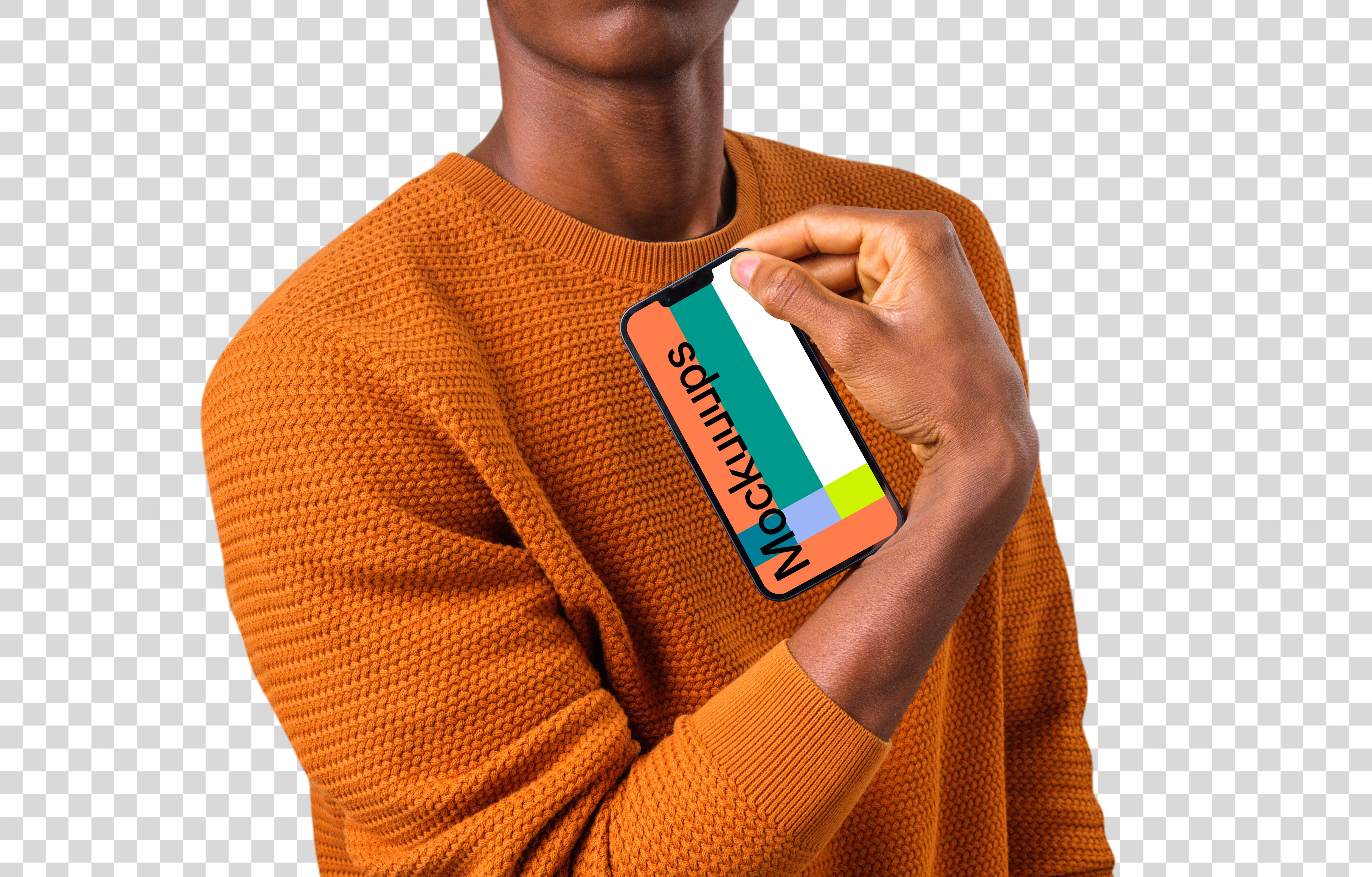 Man in orange sweater holding iPhone mockup in one hand