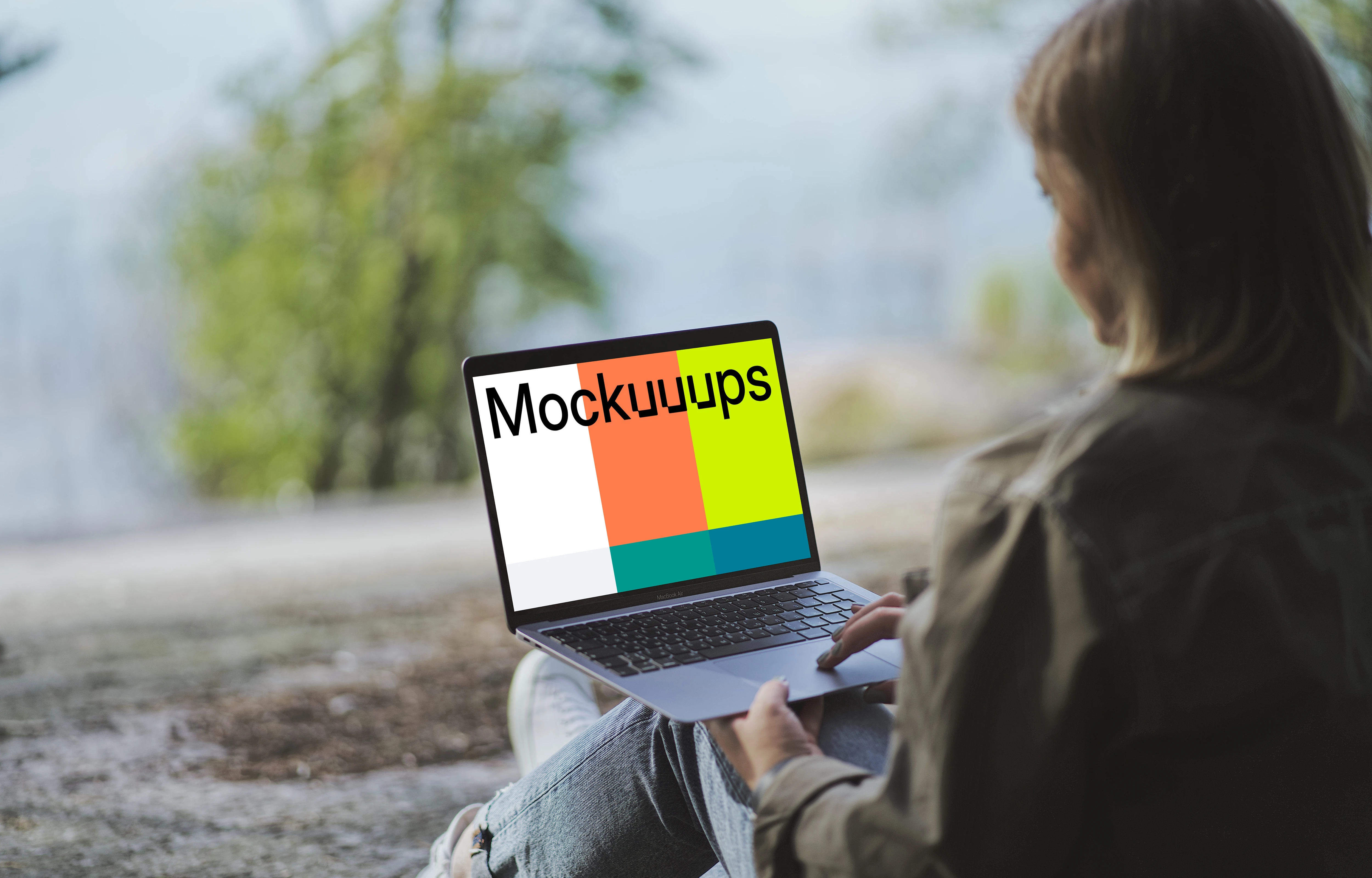 Young woman reading on MacBook Air mockup