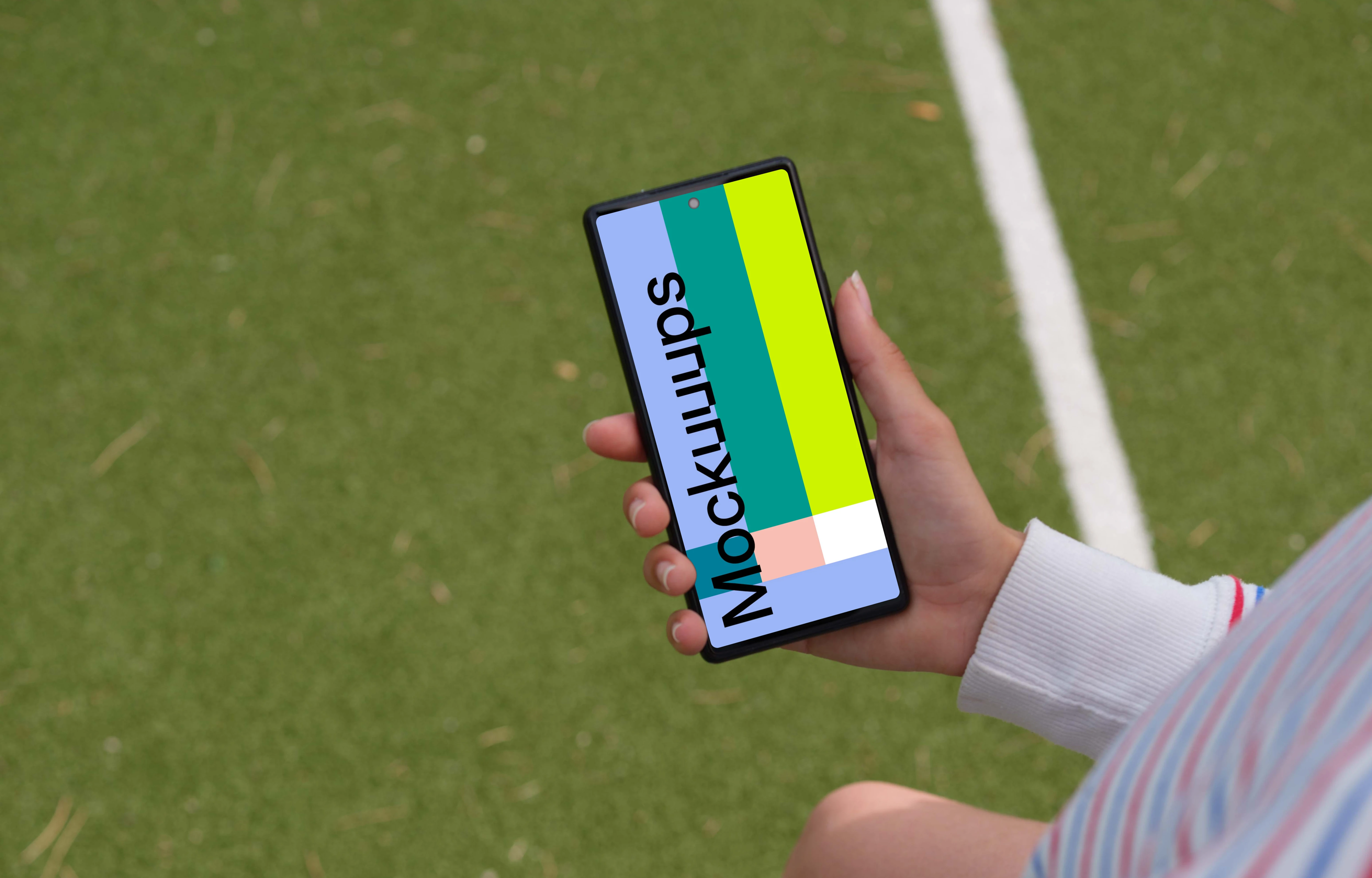 Young footbal player checking on a Google Pixel 6 mockup