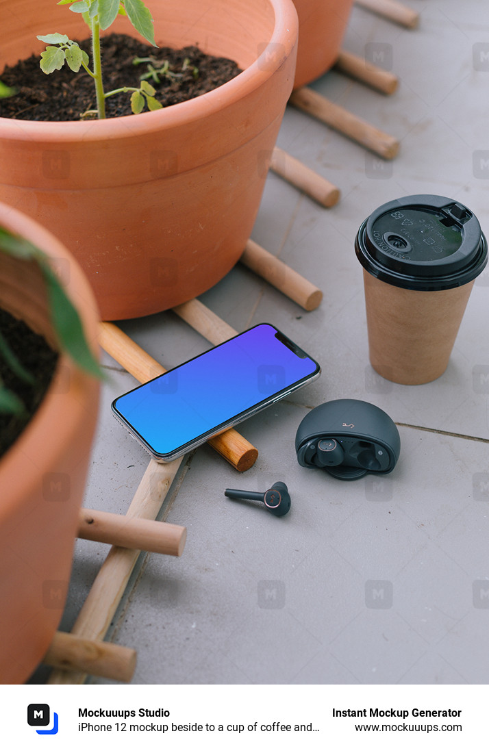  iPhone 12 mockup beside to a cup of coffee and earbuds