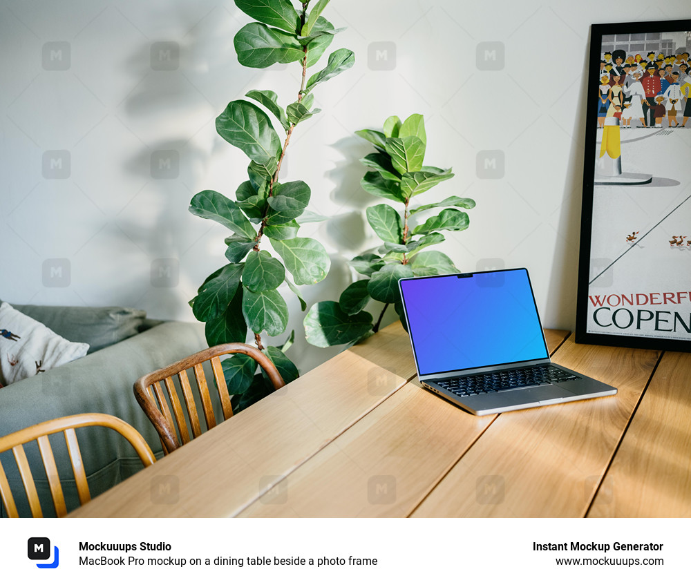 MacBook Pro mockup on a dining table beside a photo frame
