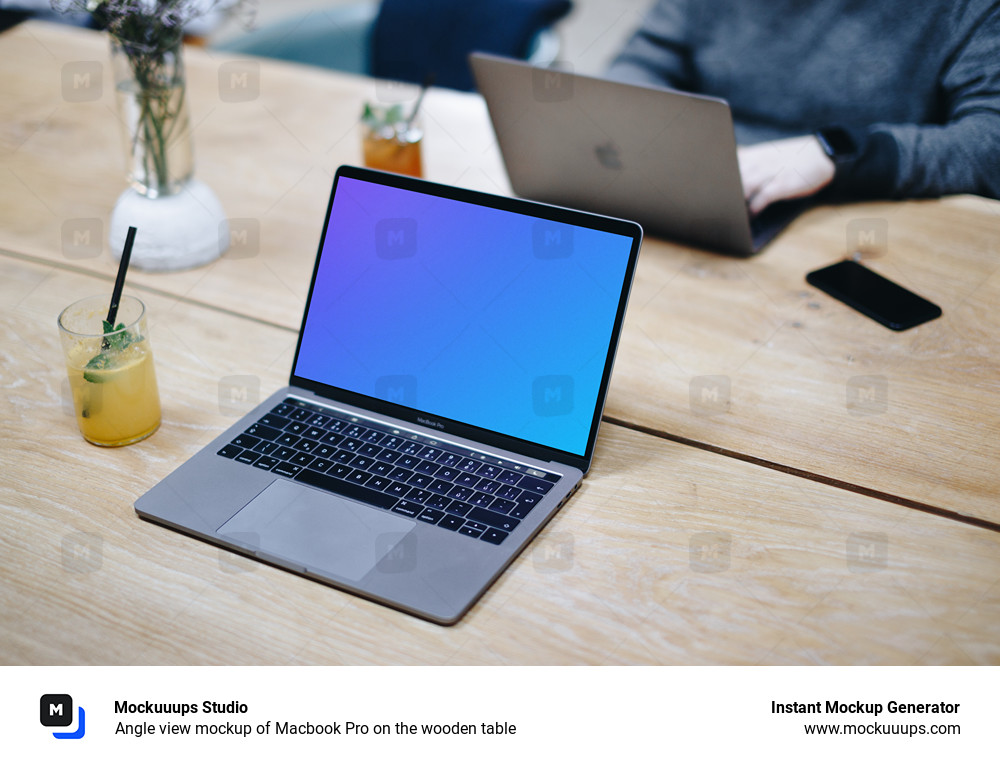 Angle view mockup of Macbook Pro on the wooden table