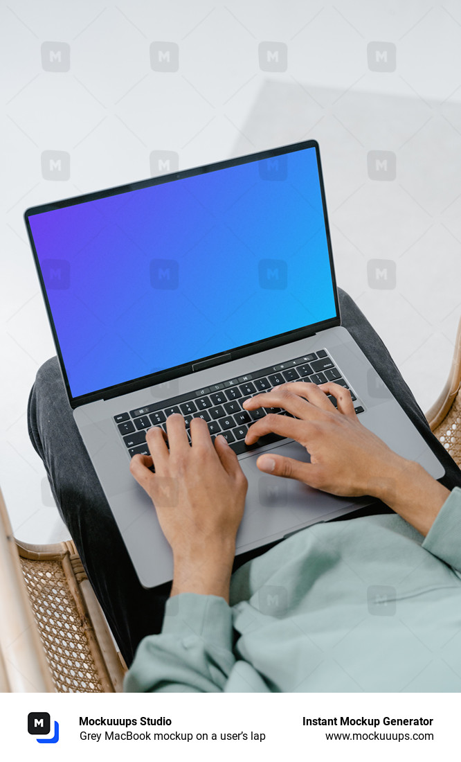 Grey MacBook mockup on a user’s lap