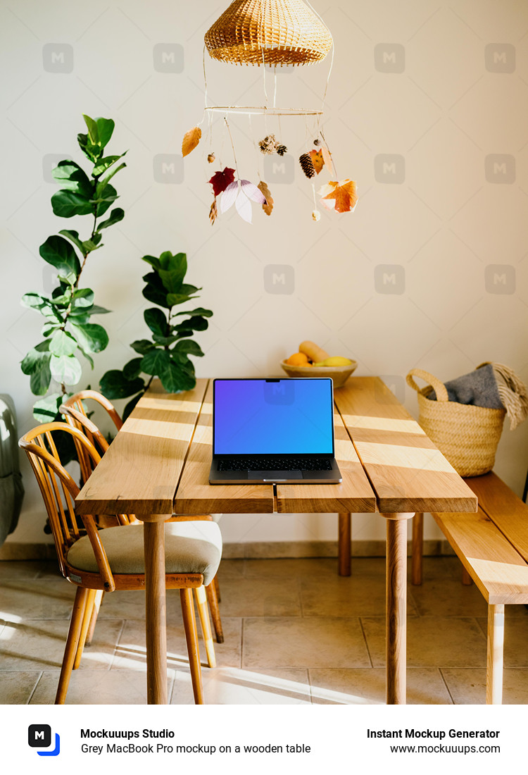 Grey MacBook Pro mockup on a wooden table