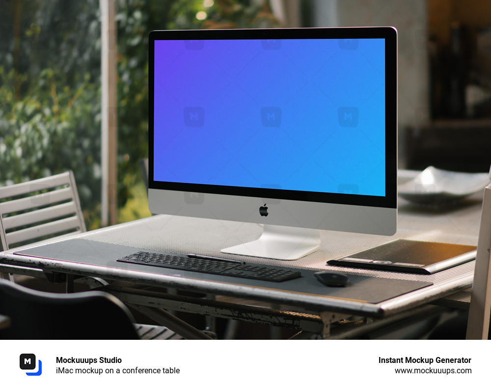 iMac mockup on a conference table