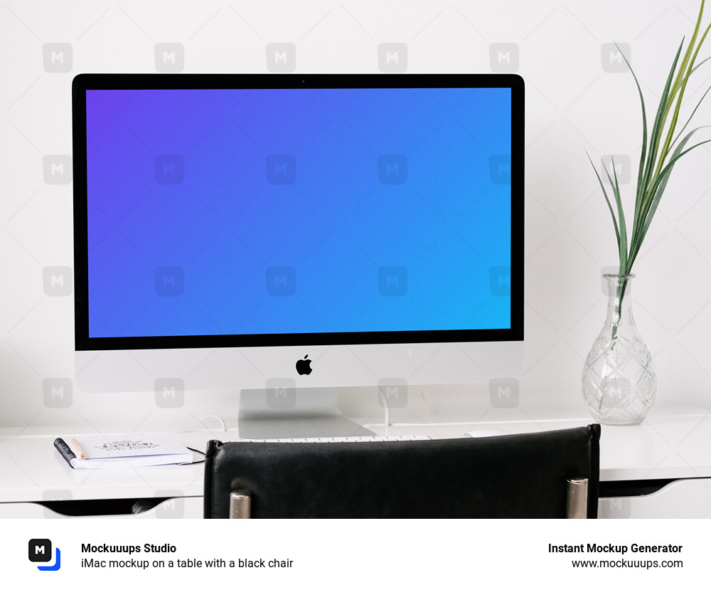 iMac mockup on a table with a black chair