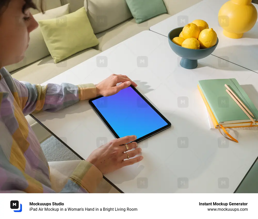 iPad Air Mockup in a Woman's Hand in a Bright Living Room