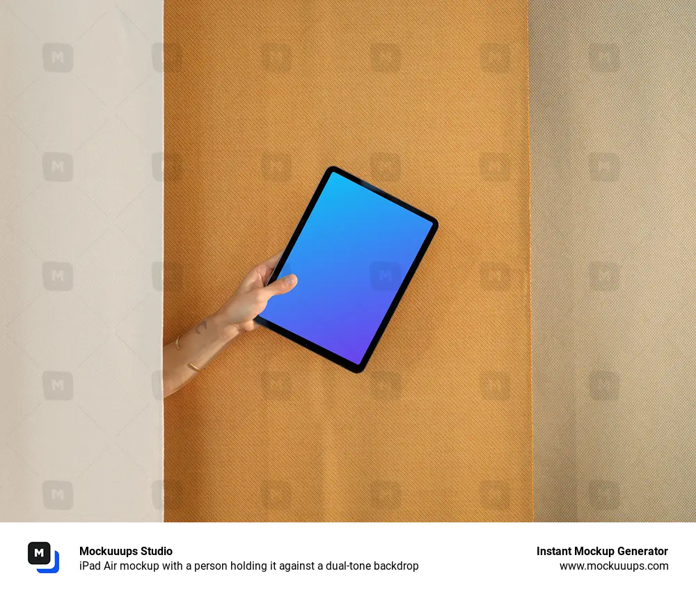 iPad Air mockup with a person holding it against a dual-tone backdrop