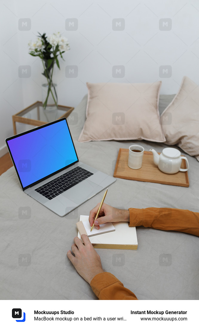 MacBook mockup on a bed with a user writing on a notebook