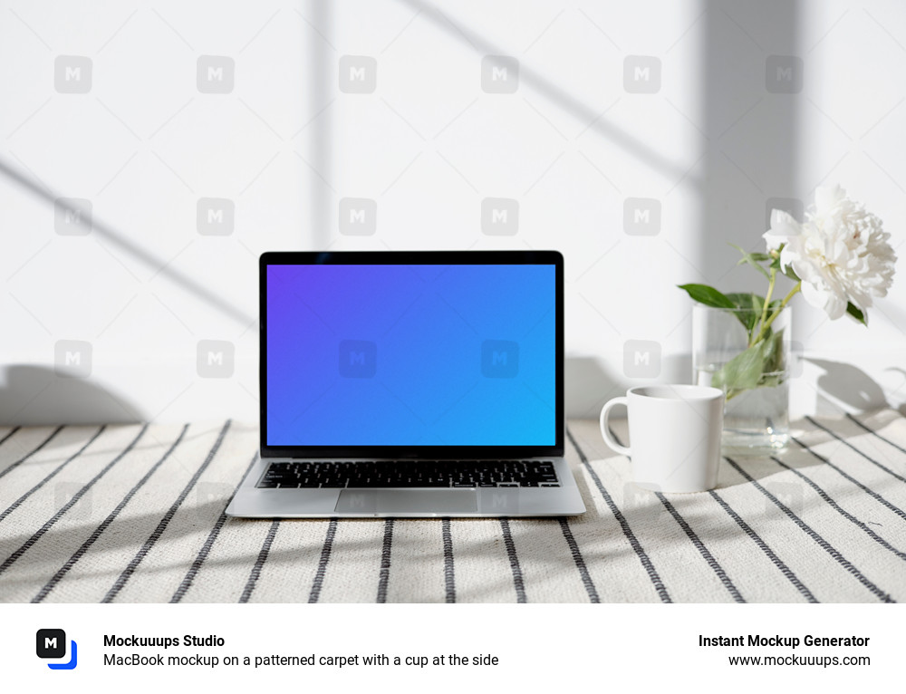 MacBook mockup on a patterned carpet with a cup at the side
