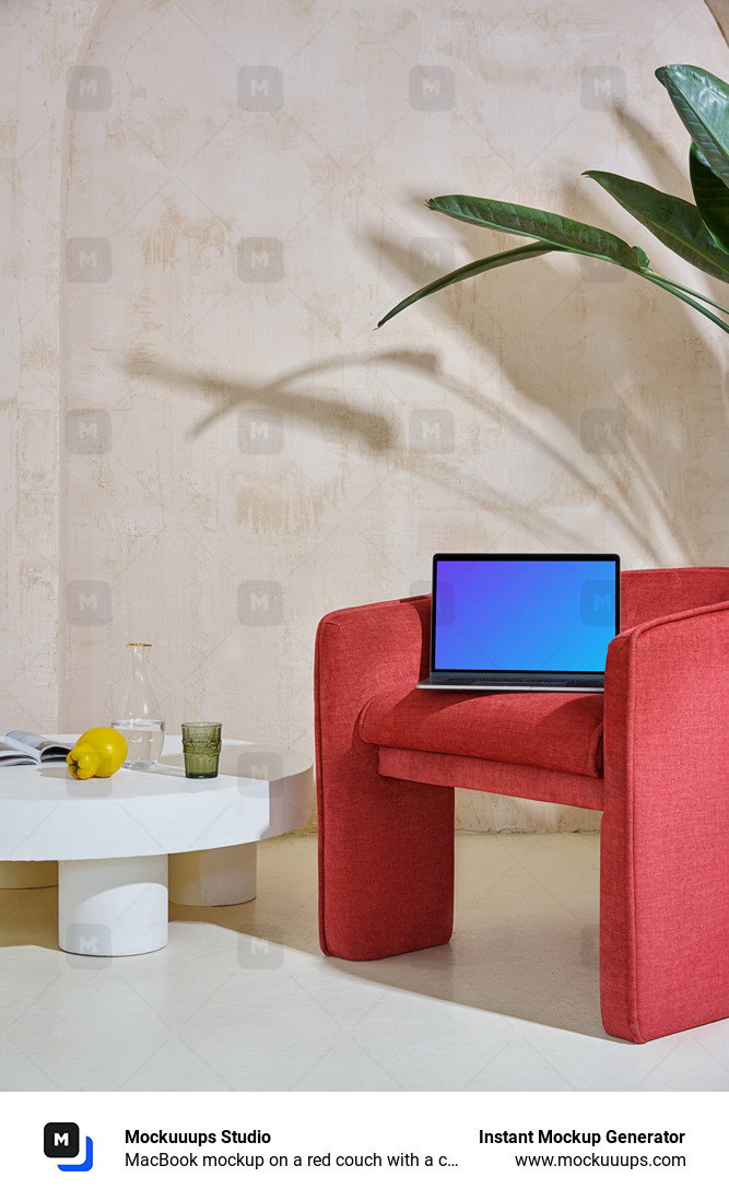 MacBook mockup on a red couch with a center table close by